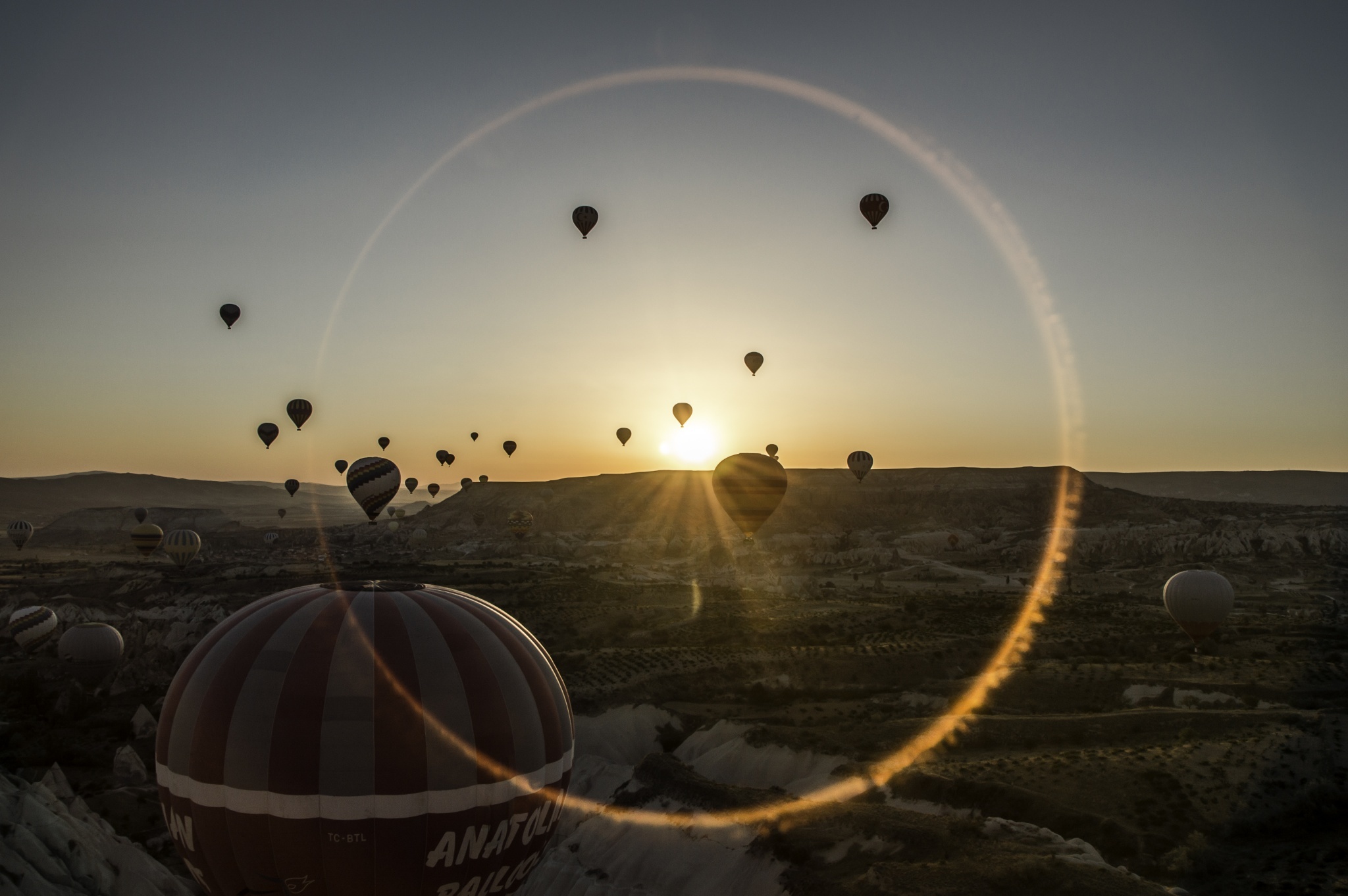 Download mobile wallpaper Landscape, Sunset, Desert, Sunbeam, Vehicles, Hot Air Balloon for free.