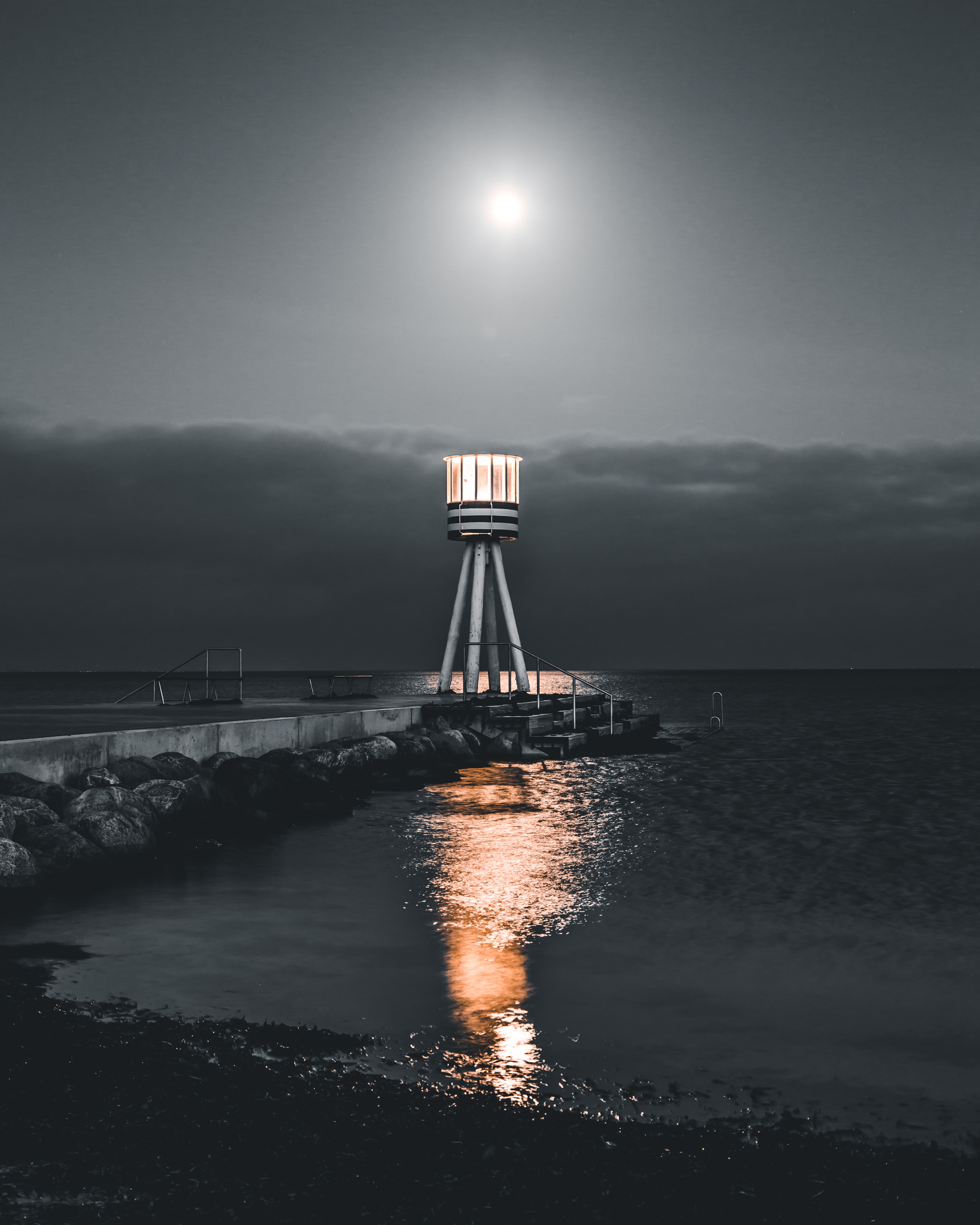 Free download wallpaper Water, Night, Lighthouse, Nature, Stones, Pier, Sea on your PC desktop