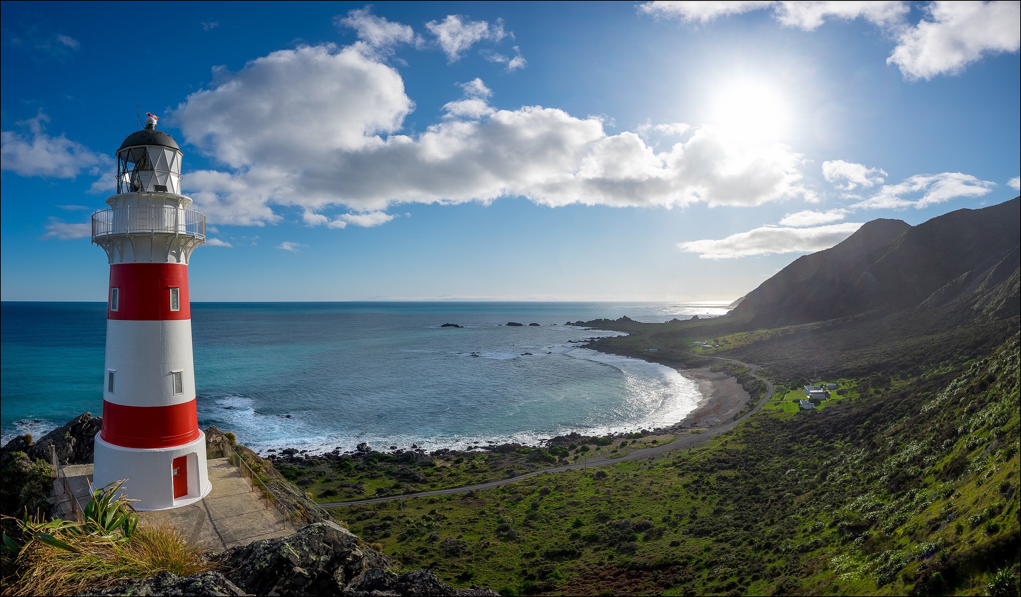 Free download wallpaper Sky, Sun, Horizon, Ocean, Lighthouse, Coastline, Man Made on your PC desktop