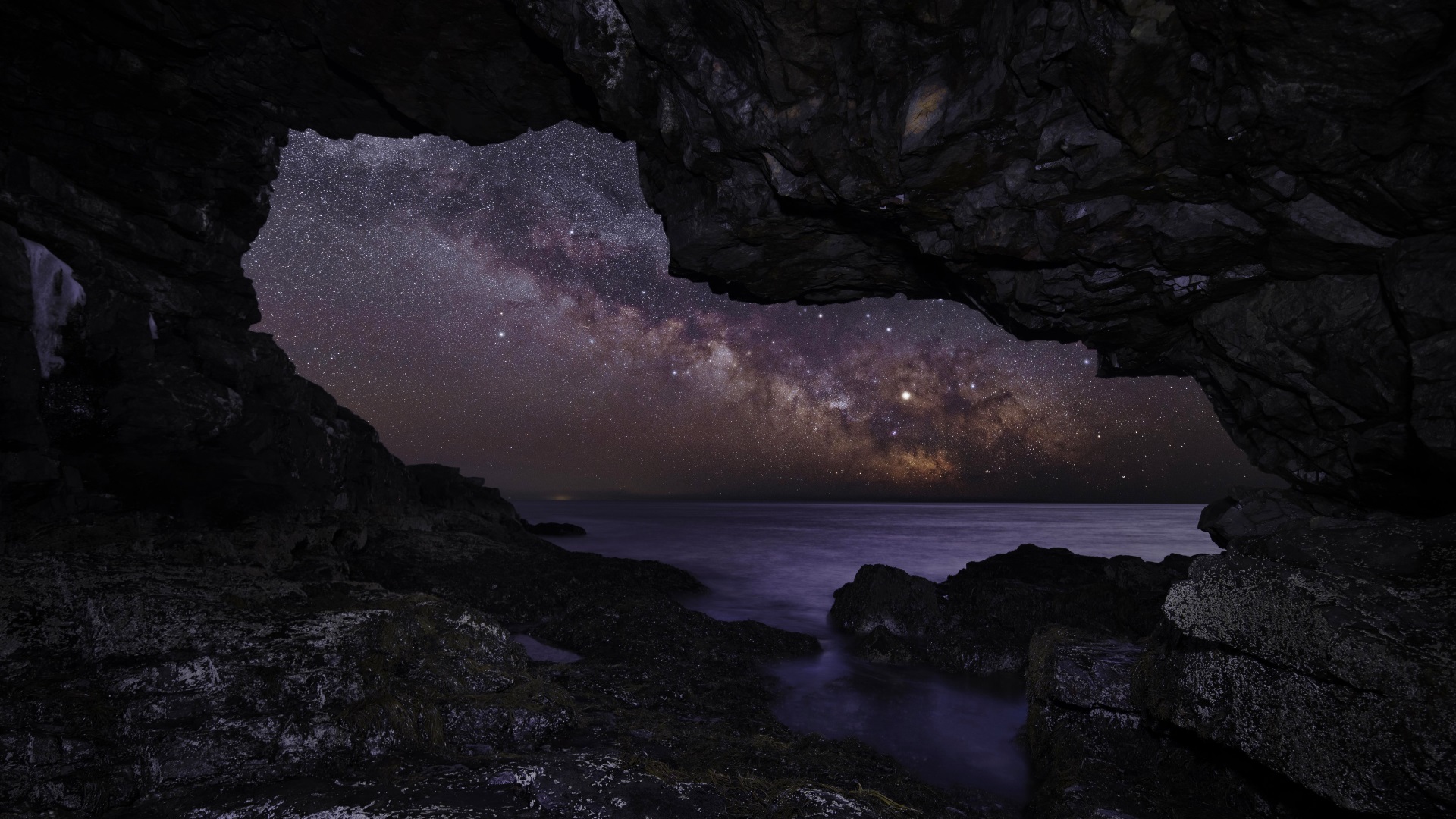 Download mobile wallpaper Sky, Sea, Stars, Night, Caves, Horizon, Ocean, Starry Sky, Earth, Milky Way, Cave for free.