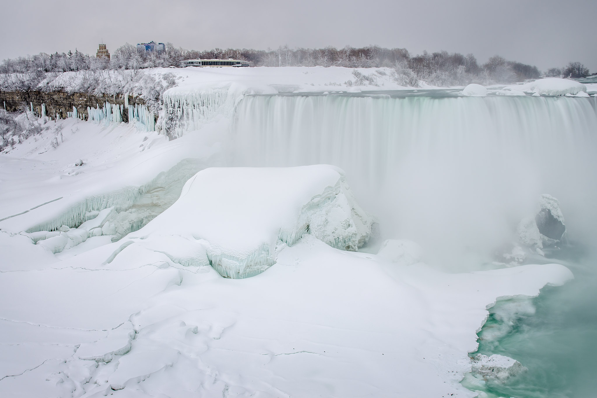 Download mobile wallpaper Winter, Waterfalls, Waterfall, Earth, Frozen, Niagara Falls for free.