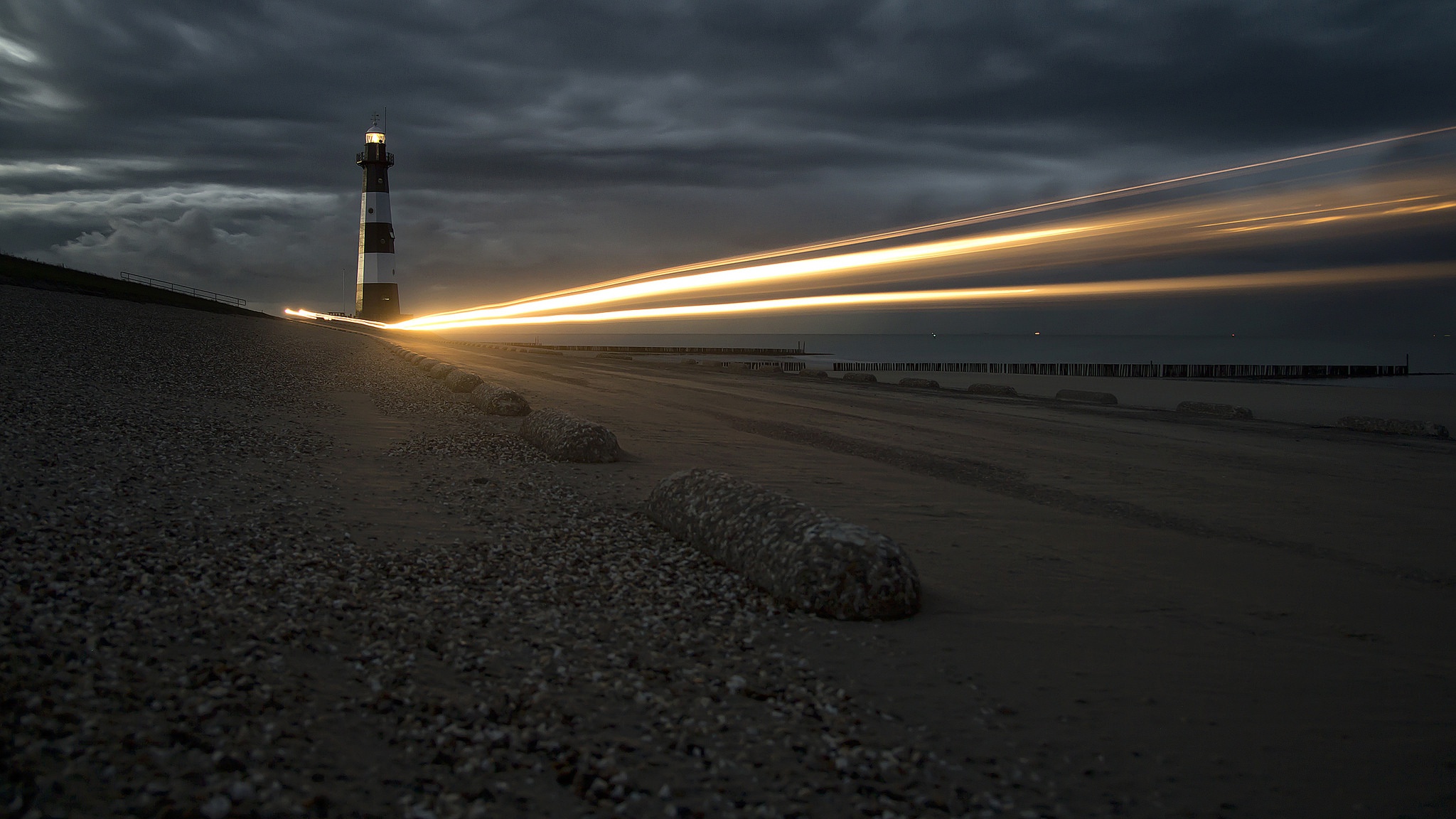 Download mobile wallpaper Beach, Sand, Light, Lighthouse, Man Made, Time Lapse for free.