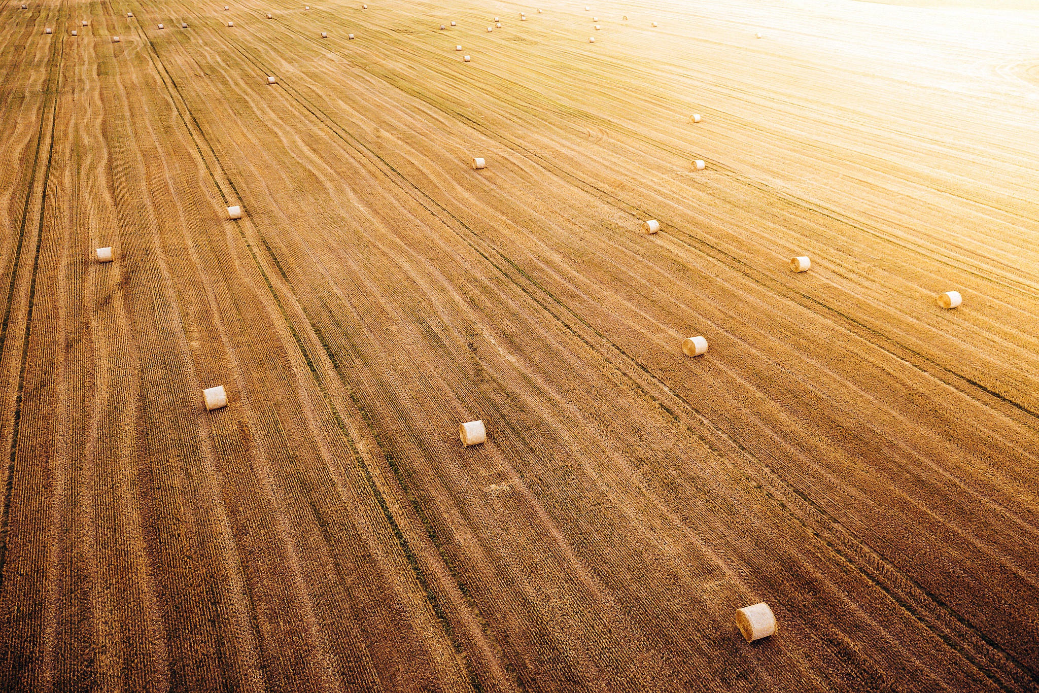 Download mobile wallpaper Summer, Earth, Field, Aerial, Haystack for free.