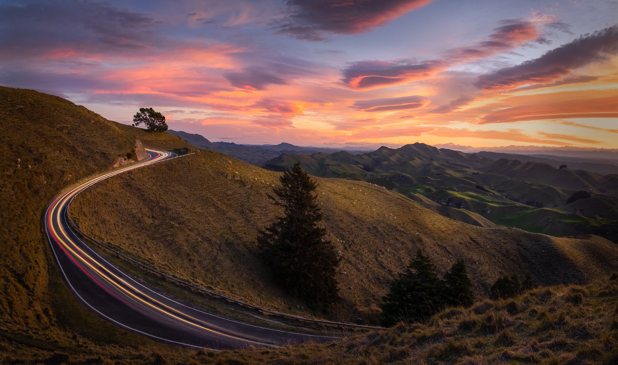 Download mobile wallpaper Sunset, Mountain, New Zealand, Road, Hill, Man Made, Time Lapse for free.