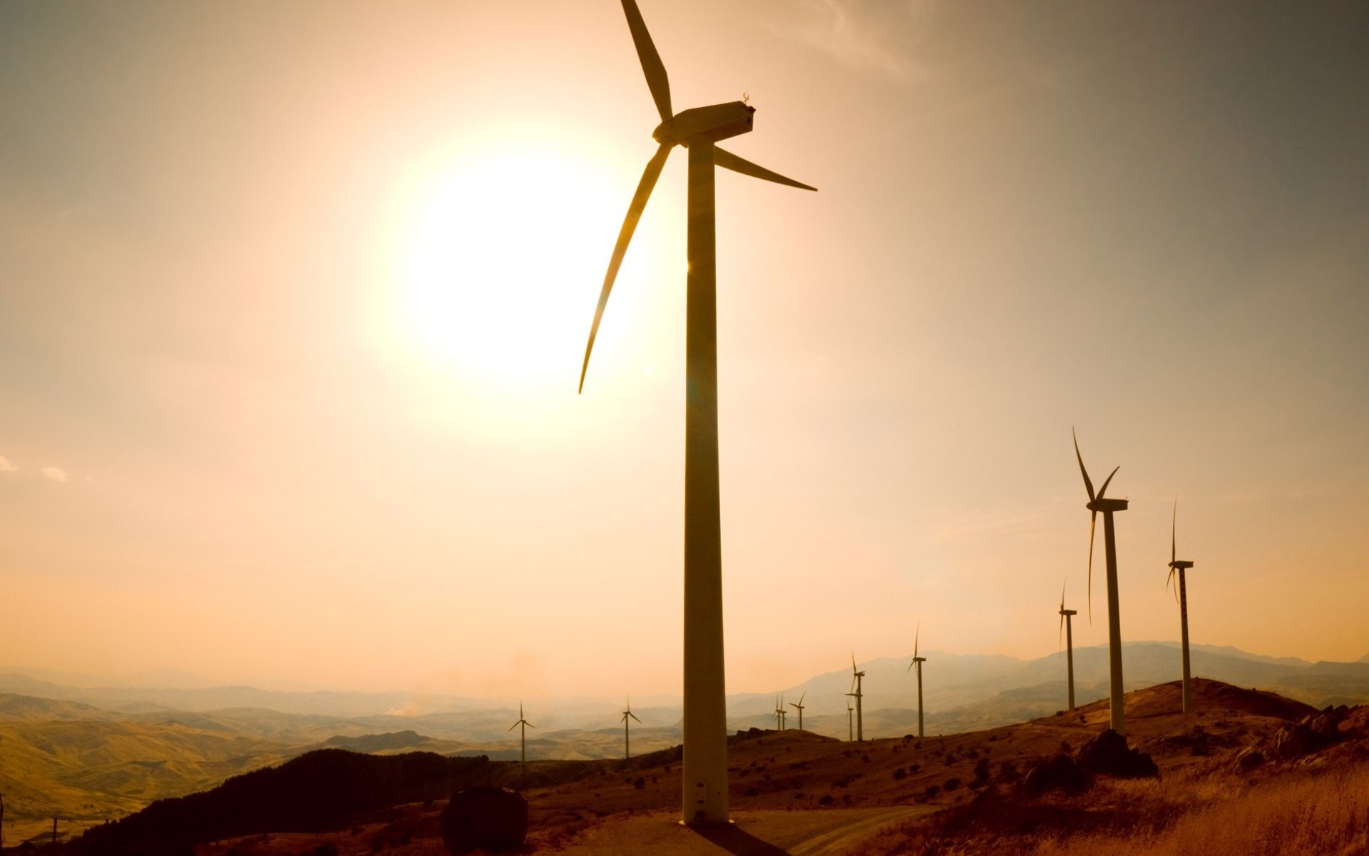 Download mobile wallpaper Sun, Hill, Wind Turbine, Man Made for free.