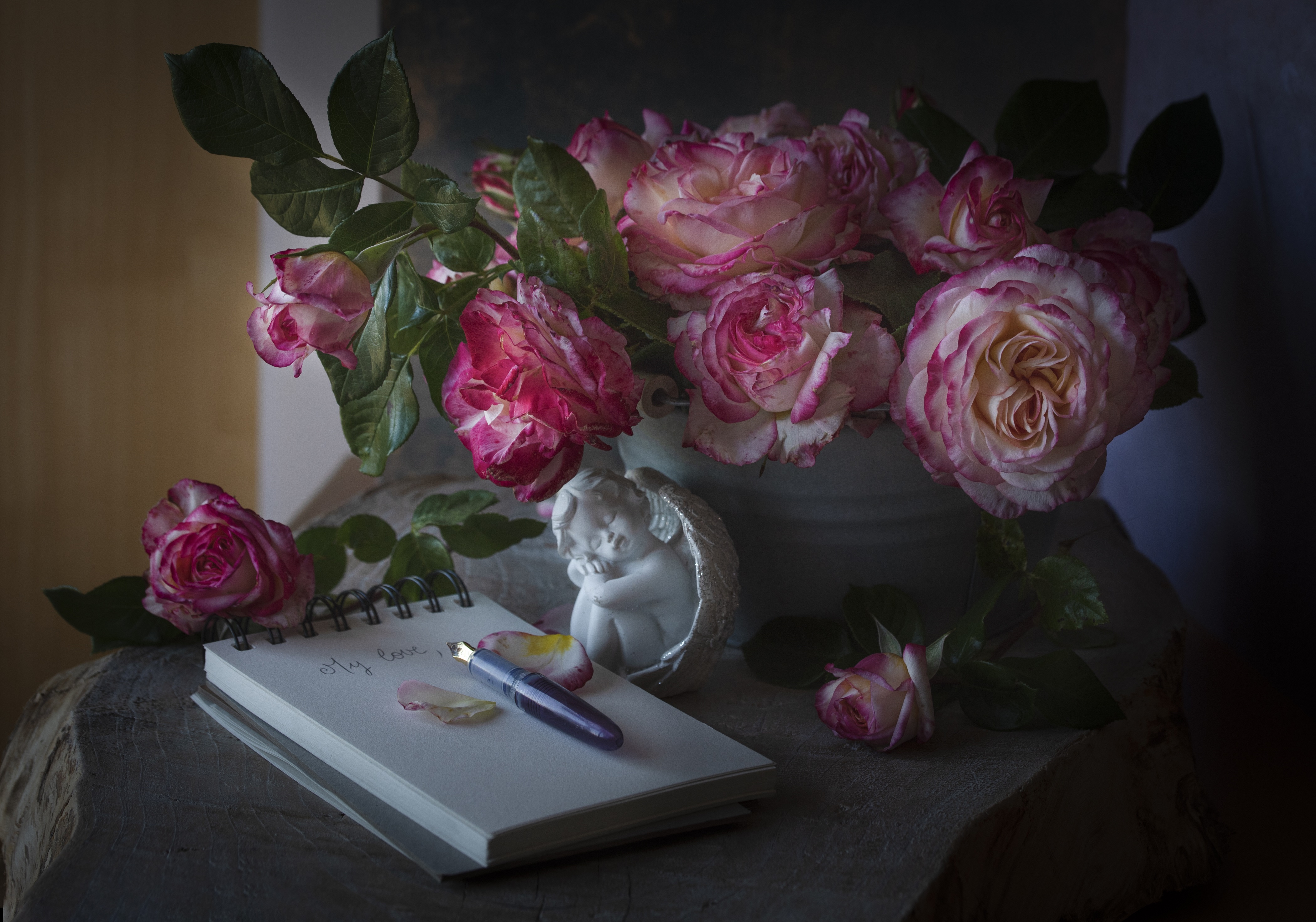 Download mobile wallpaper Still Life, Flower, Rose, Notebook, Photography, Angel Statue, Cherub for free.