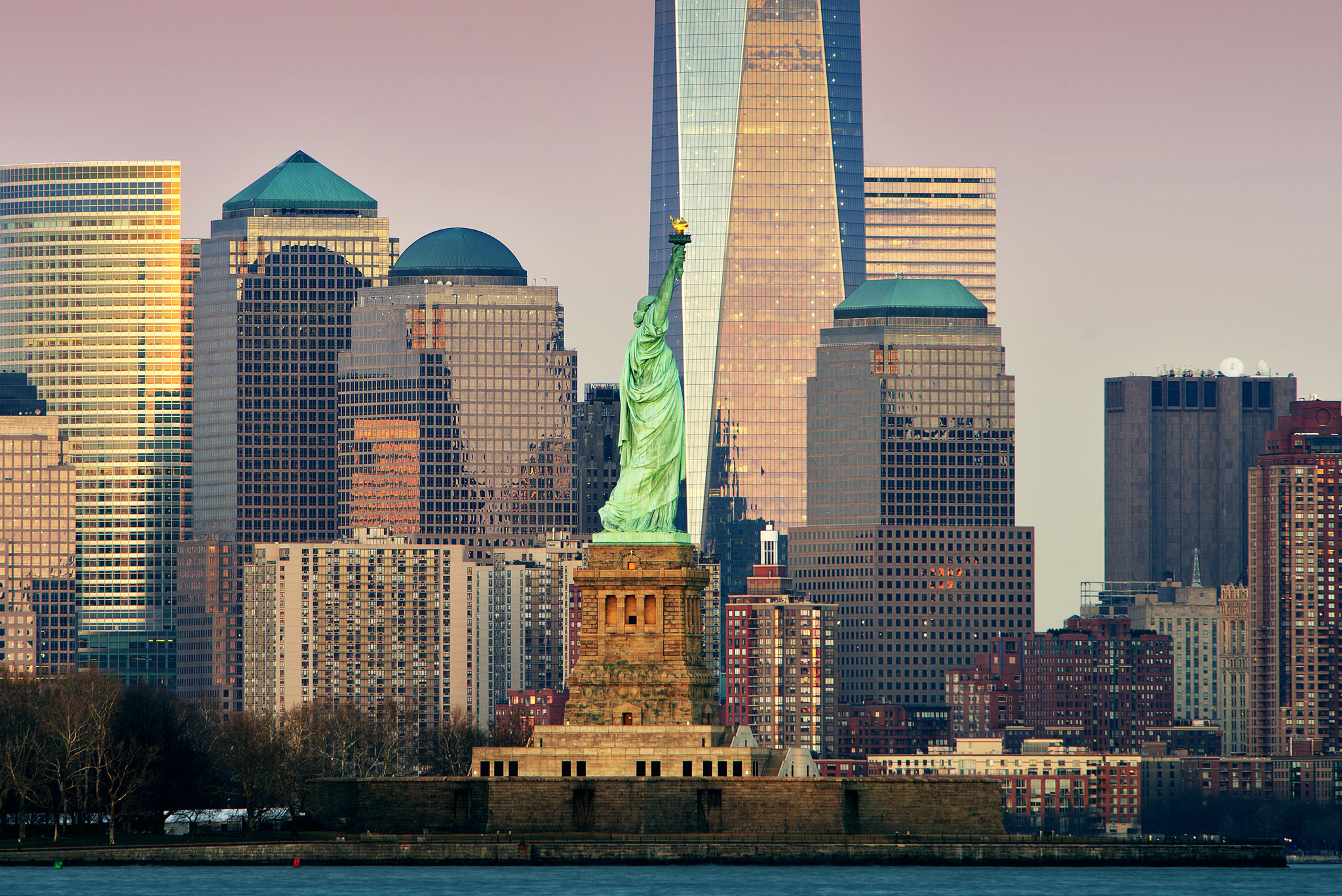 Download mobile wallpaper Statue Of Liberty, Usa, Skyscraper, Building, New York, Man Made for free.