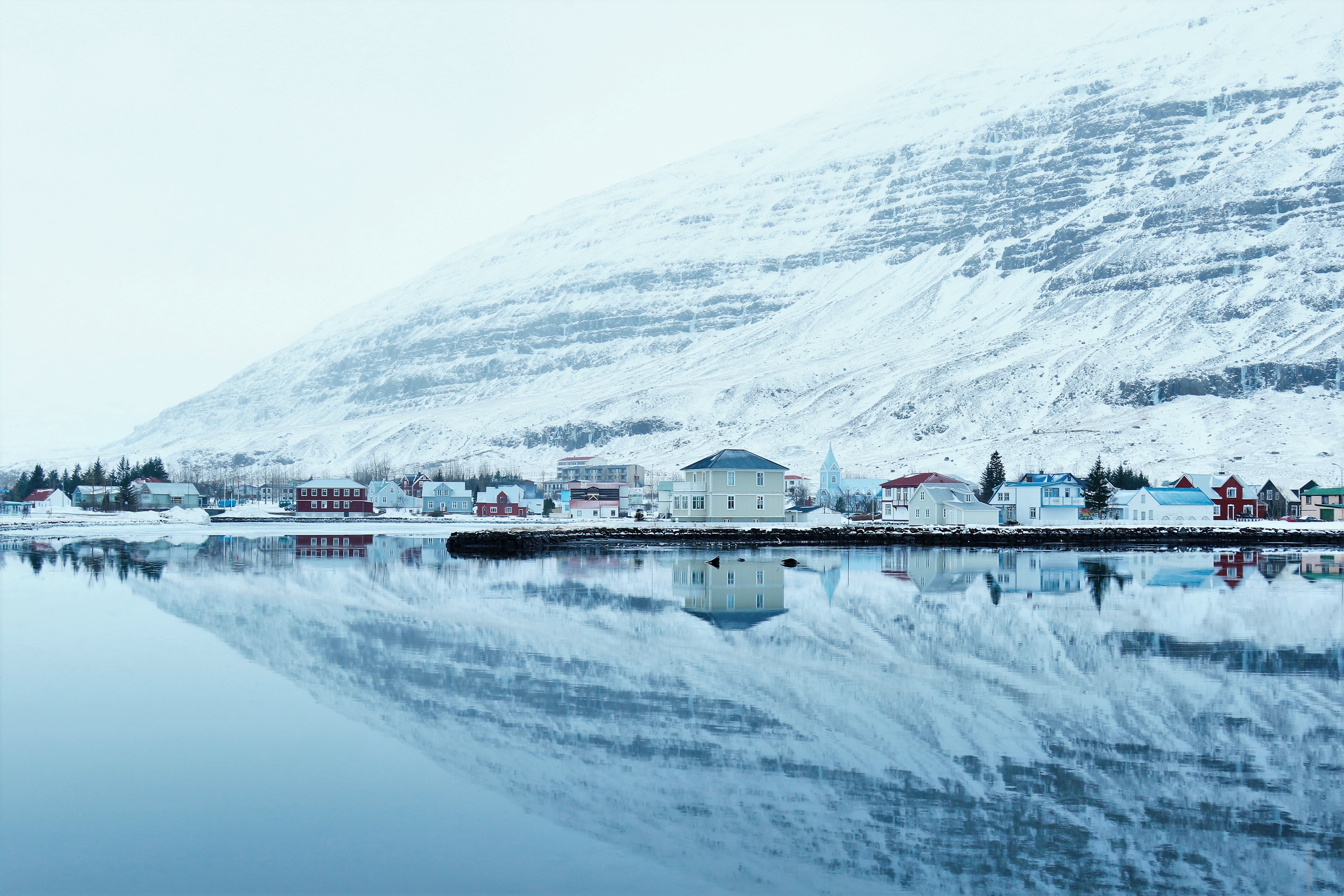 Download mobile wallpaper Winter, Snow, Reflection, Town, Man Made, Towns for free.