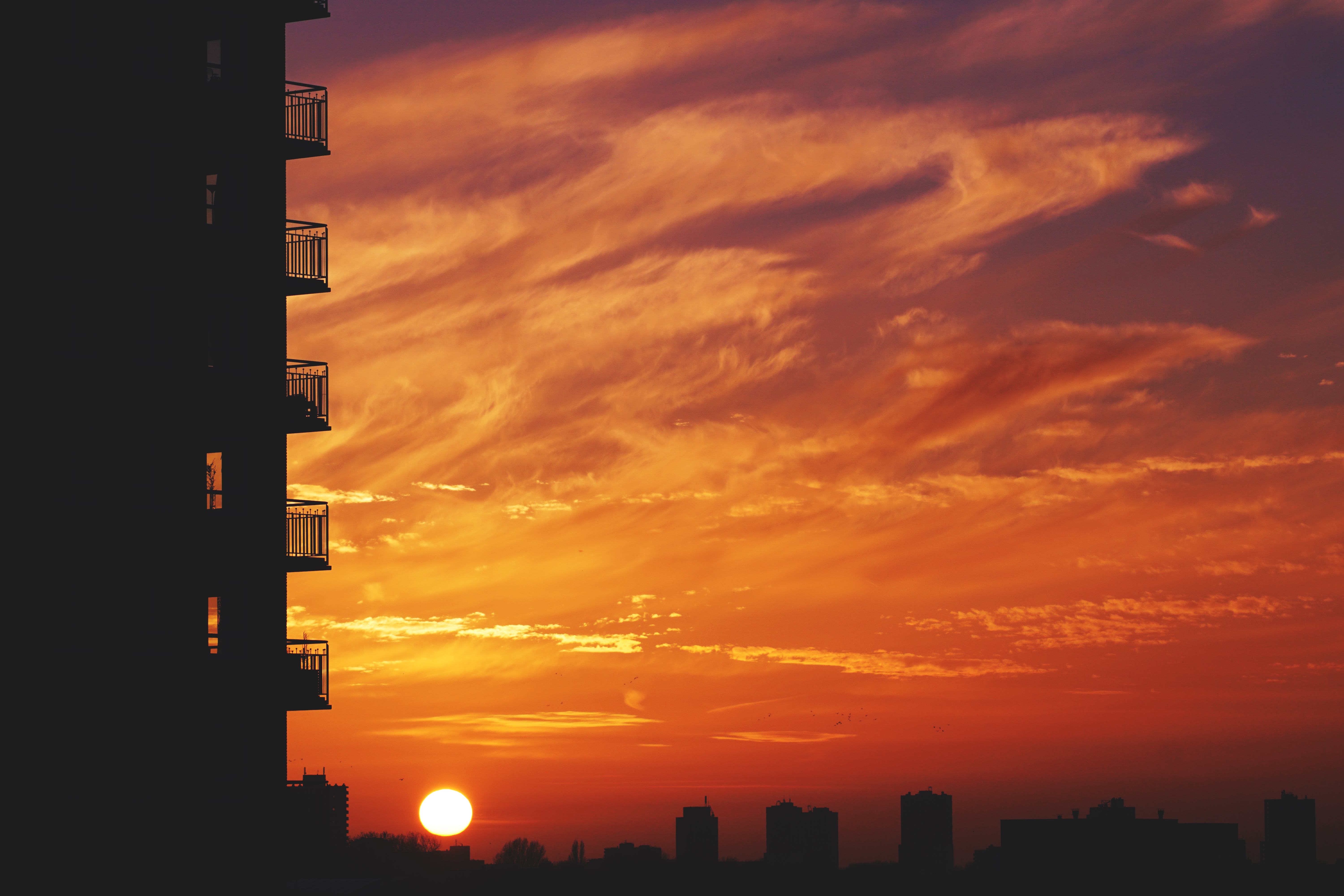 Download mobile wallpaper Sky, City, Cities, Sunset, Horizon, Balcony for free.