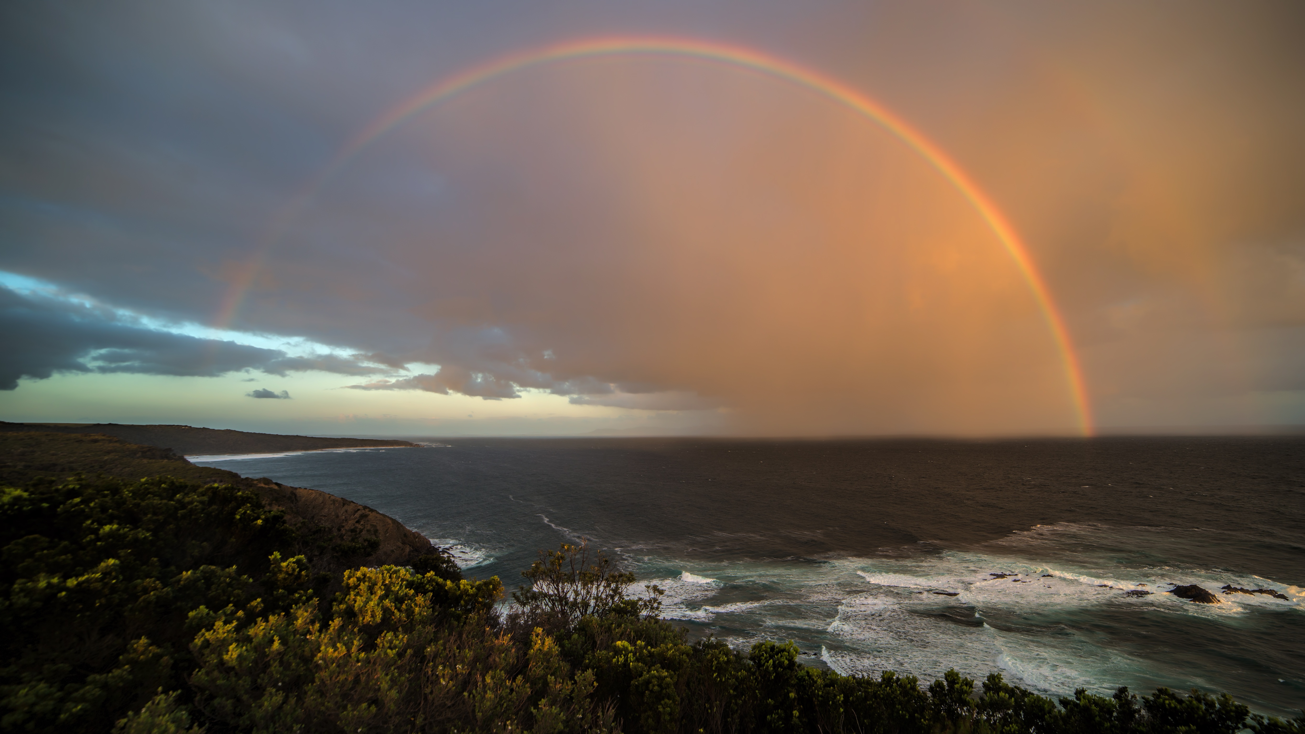 Download mobile wallpaper Rainbow, Coast, Ocean, Earth for free.