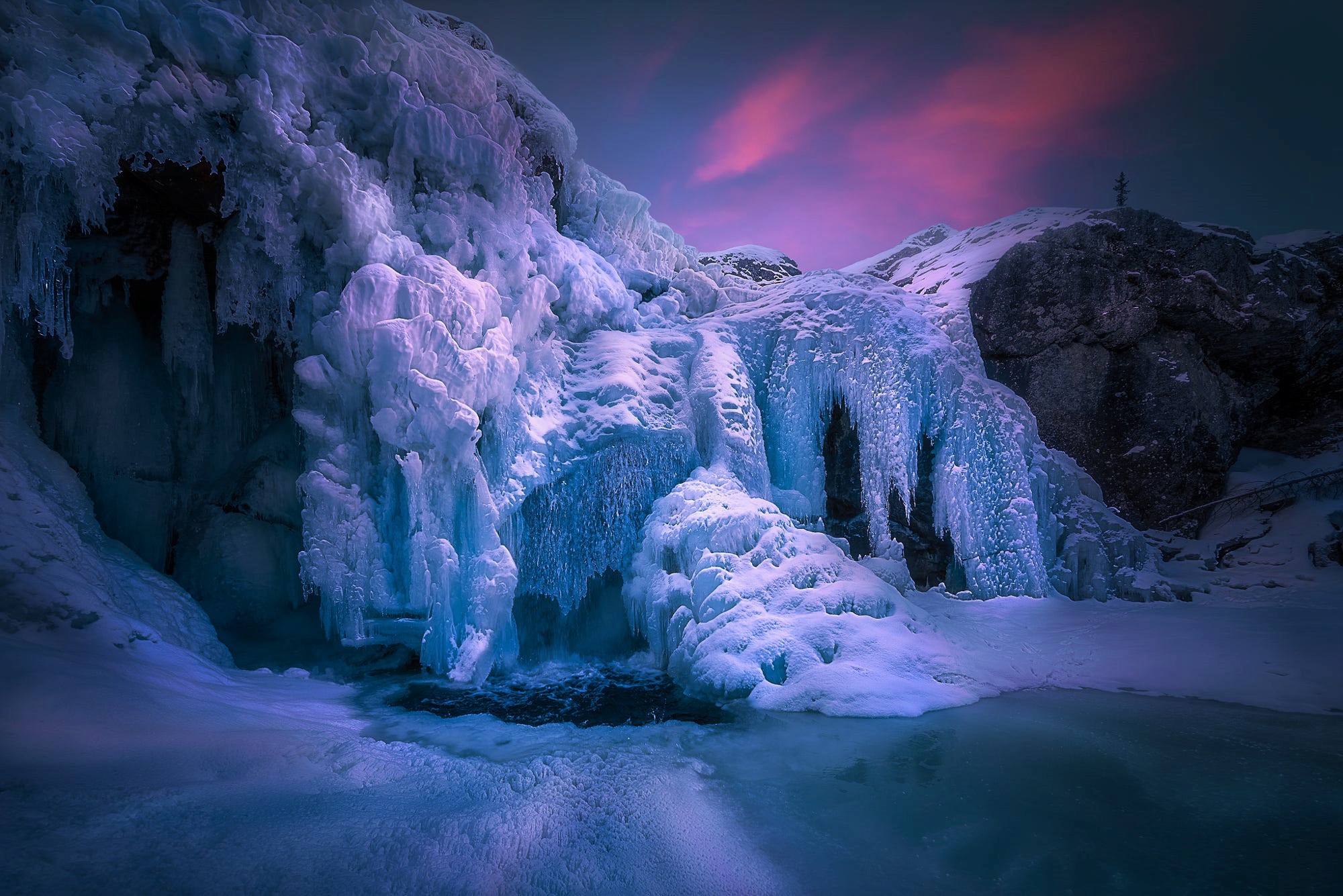 Download mobile wallpaper Sunset, Ice, Waterfalls, Waterfall, Earth, Frozen for free.
