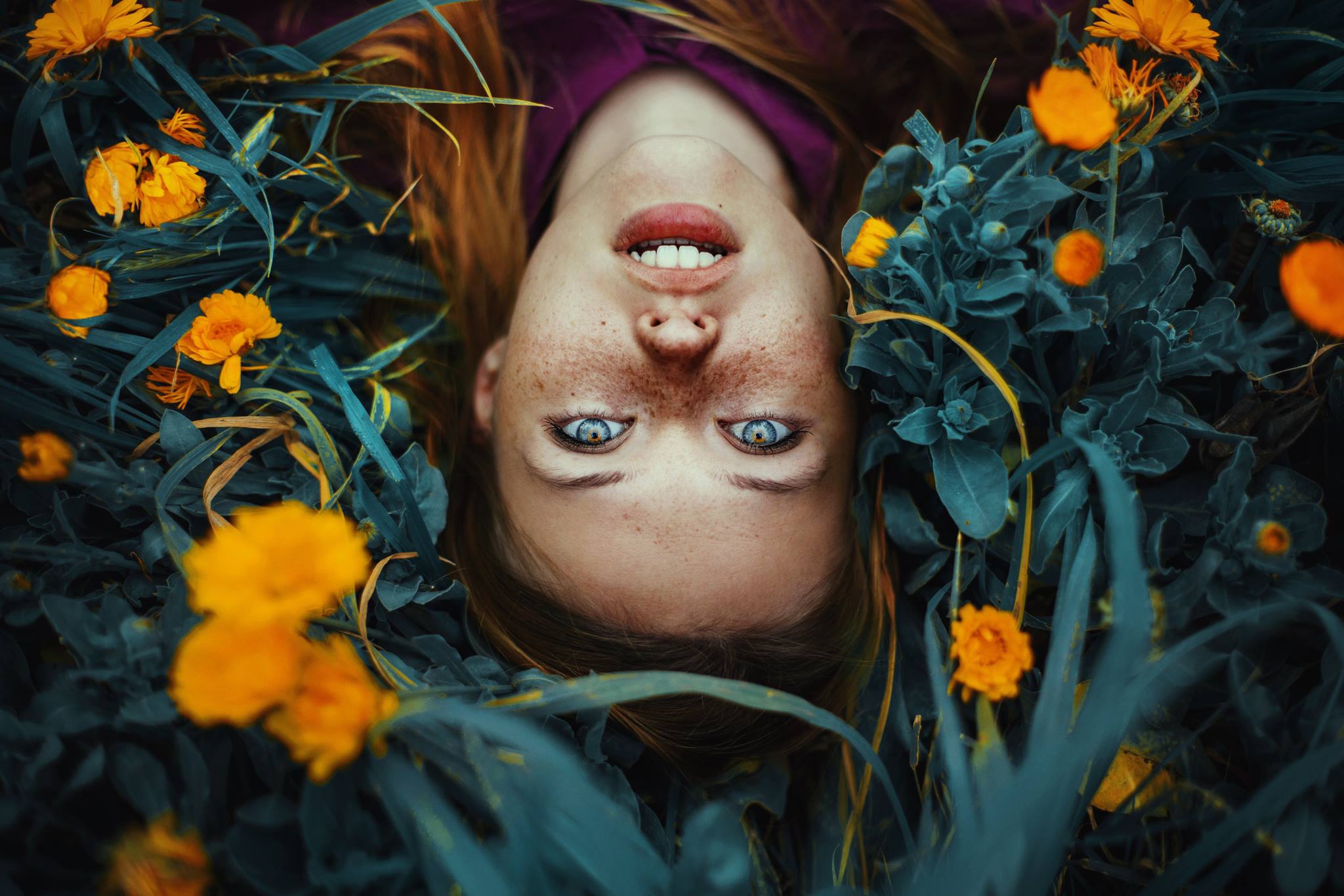 Download mobile wallpaper Redhead, Face, Model, Women, Blue Eyes, Yellow Flower, Freckles, Lying Down for free.