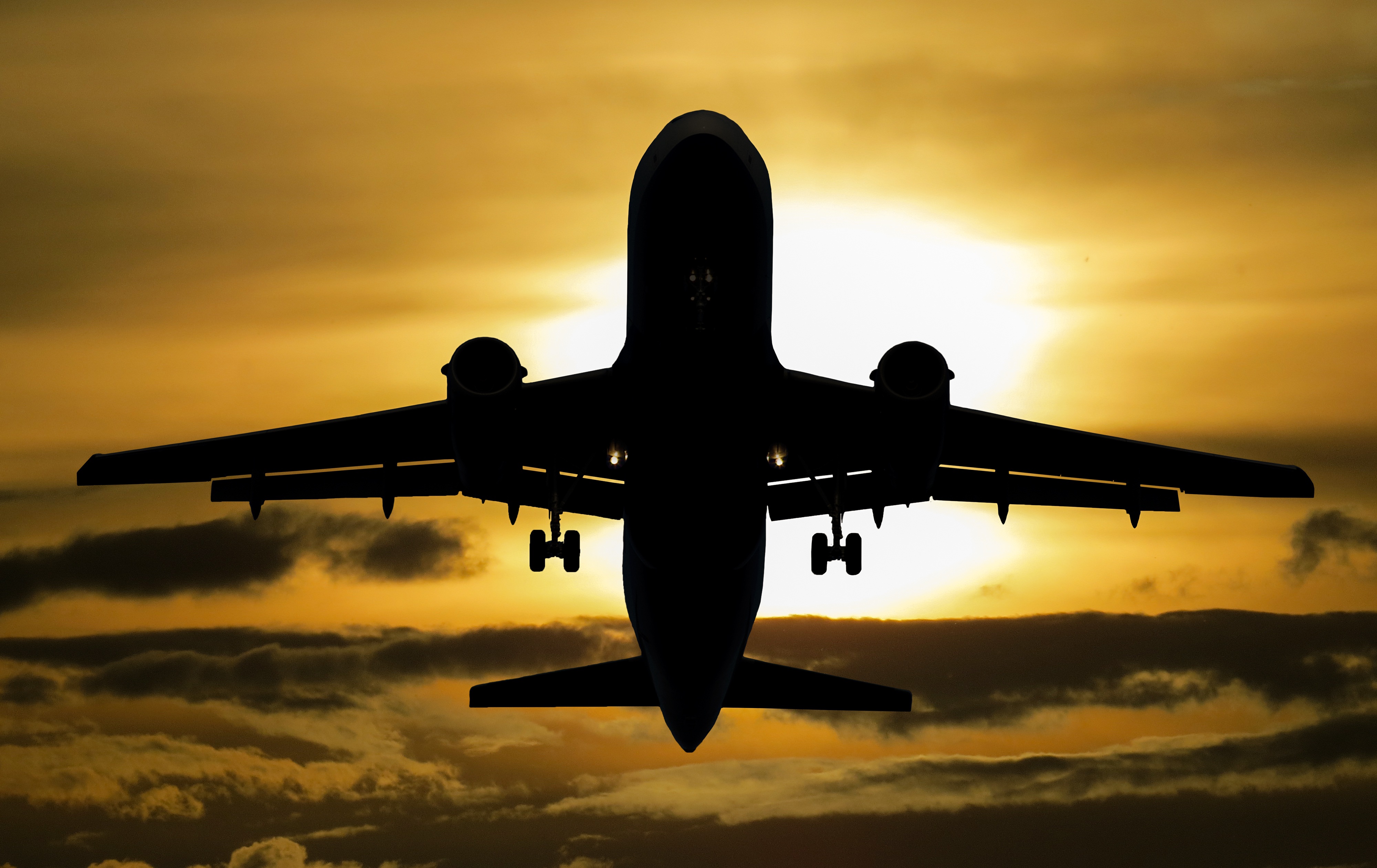 Download mobile wallpaper Sunset, Silhouette, Cloud, Aircraft, Passenger Plane, Vehicles for free.