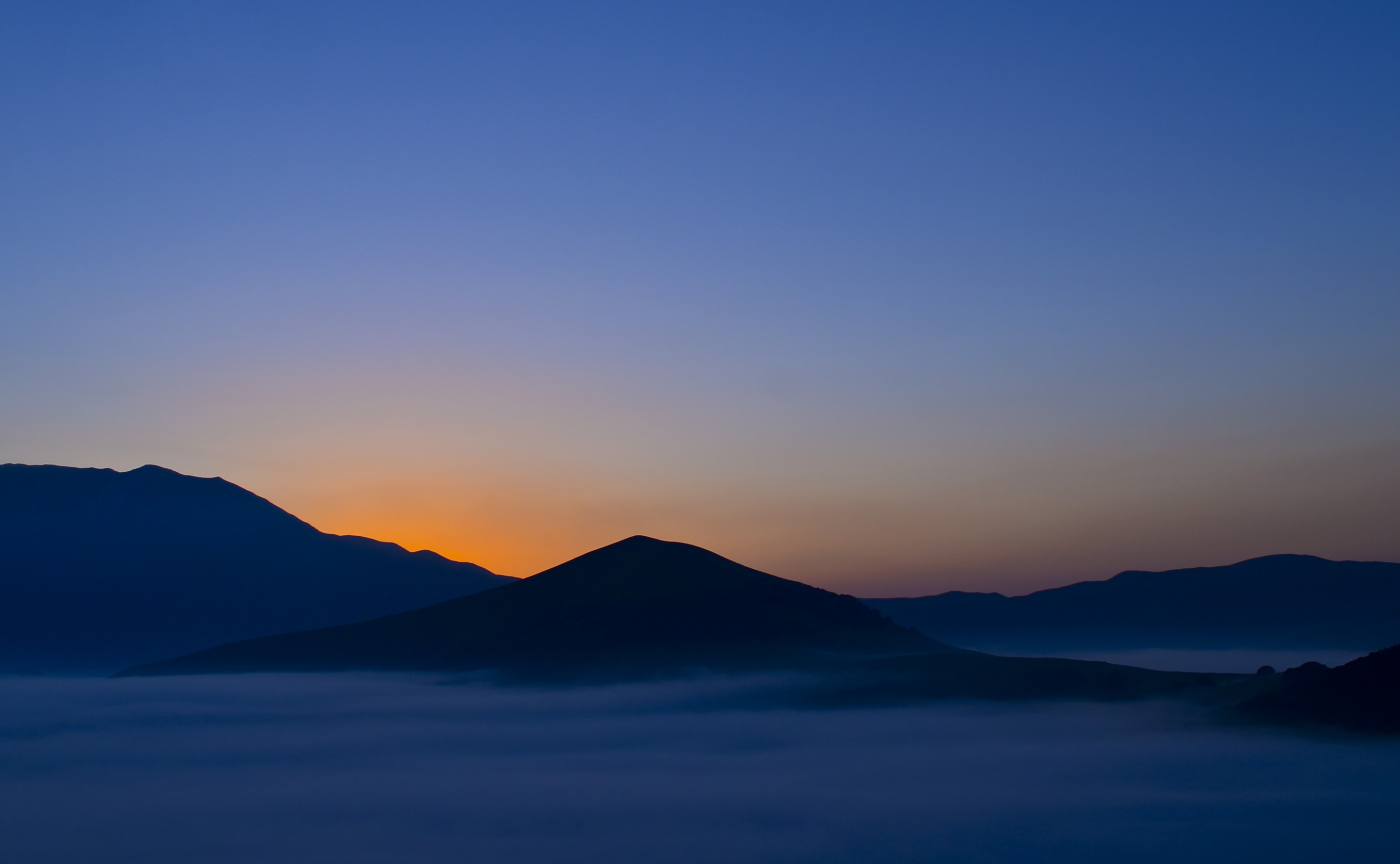 Download mobile wallpaper Landscape, Nature, Mountains, Mountain, Fog, Sunrise, Earth for free.