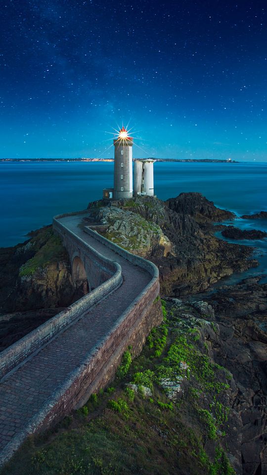 Download mobile wallpaper Sea, Night, Ocean, France, Evening, Lighthouse, Man Made for free.