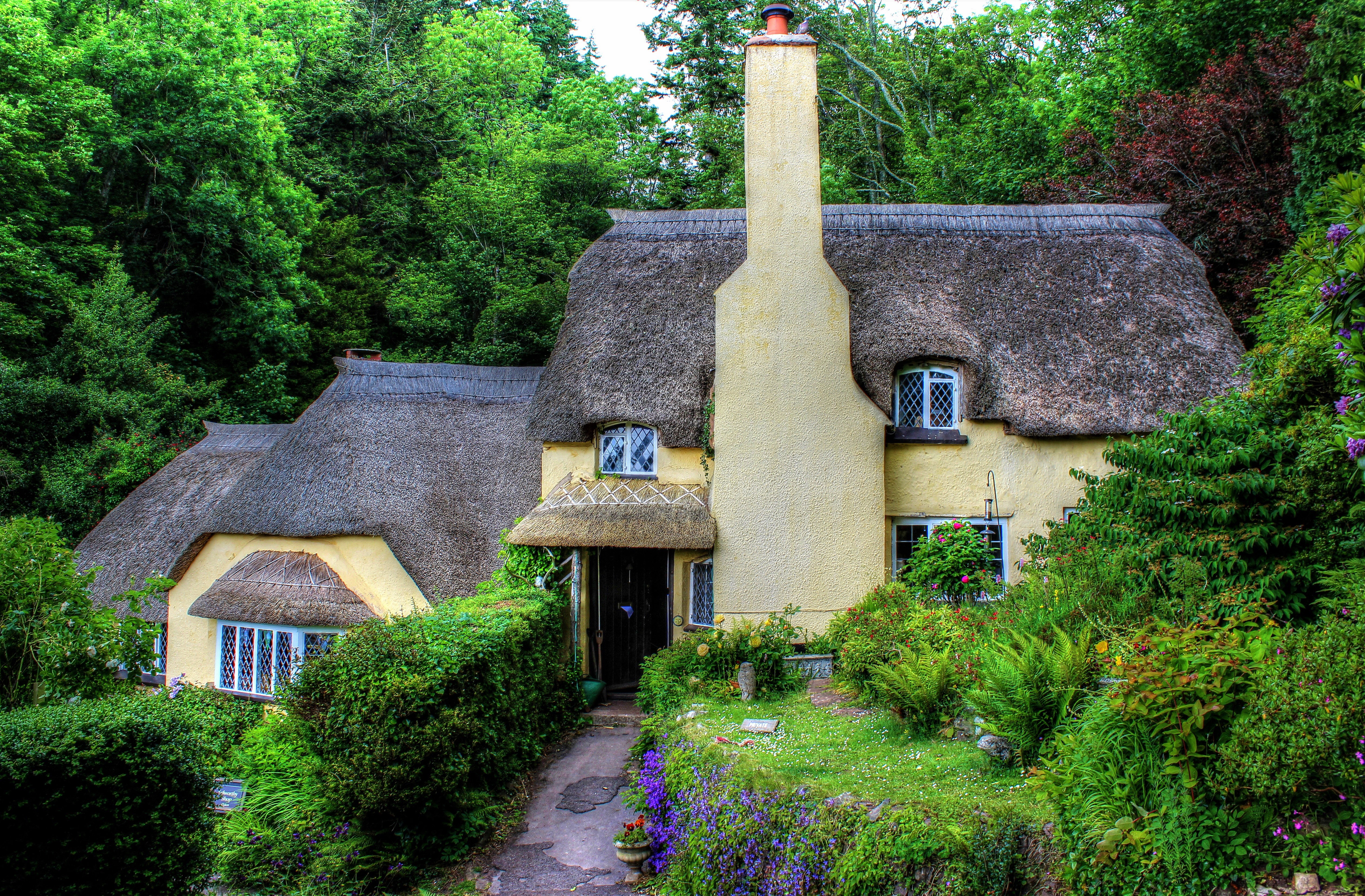 Download mobile wallpaper Spring, Cottage, England, Man Made, Thatched Roof for free.