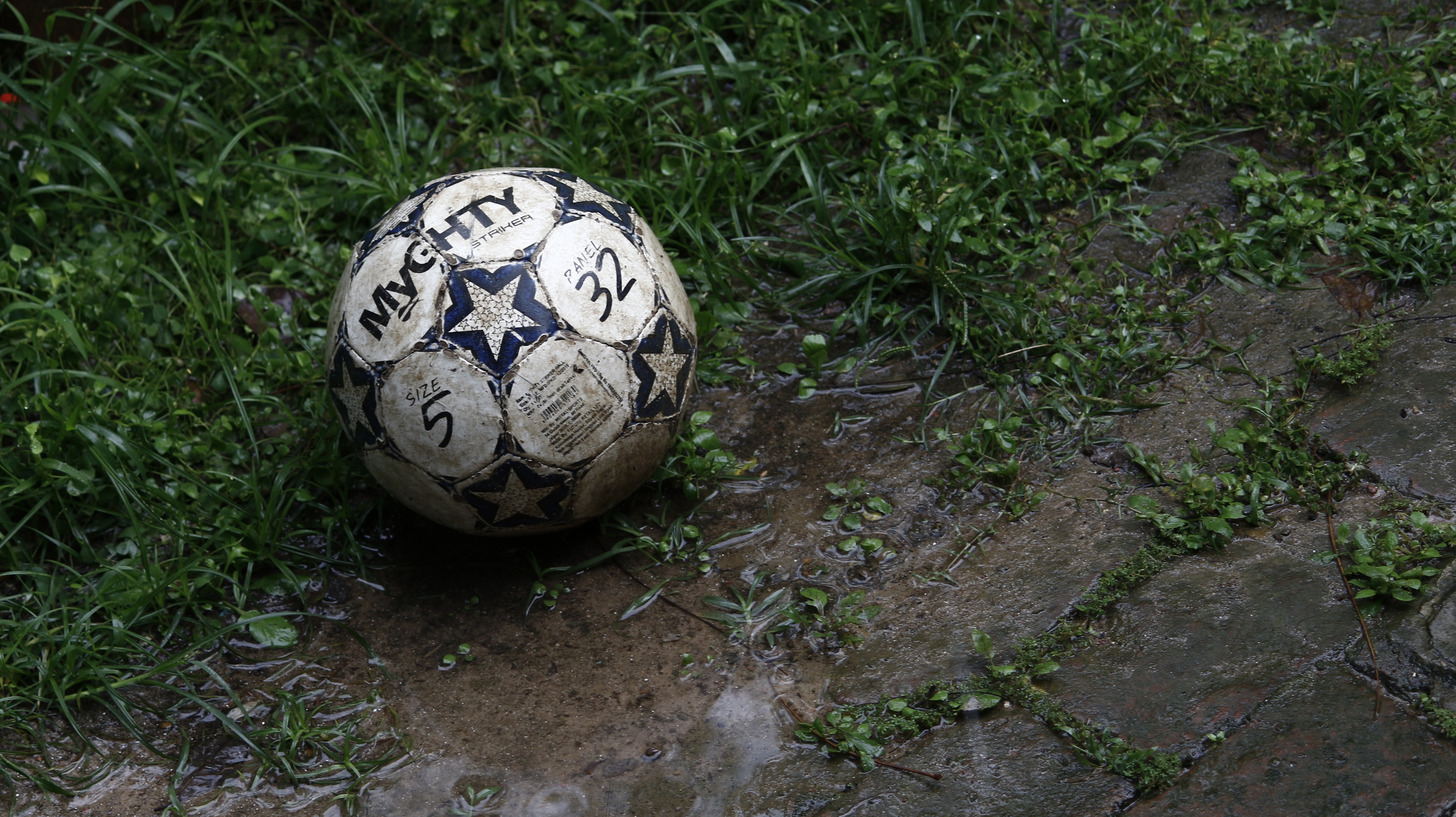 Horizontal Wallpaper football, sports, grass, ball, mud, dirt