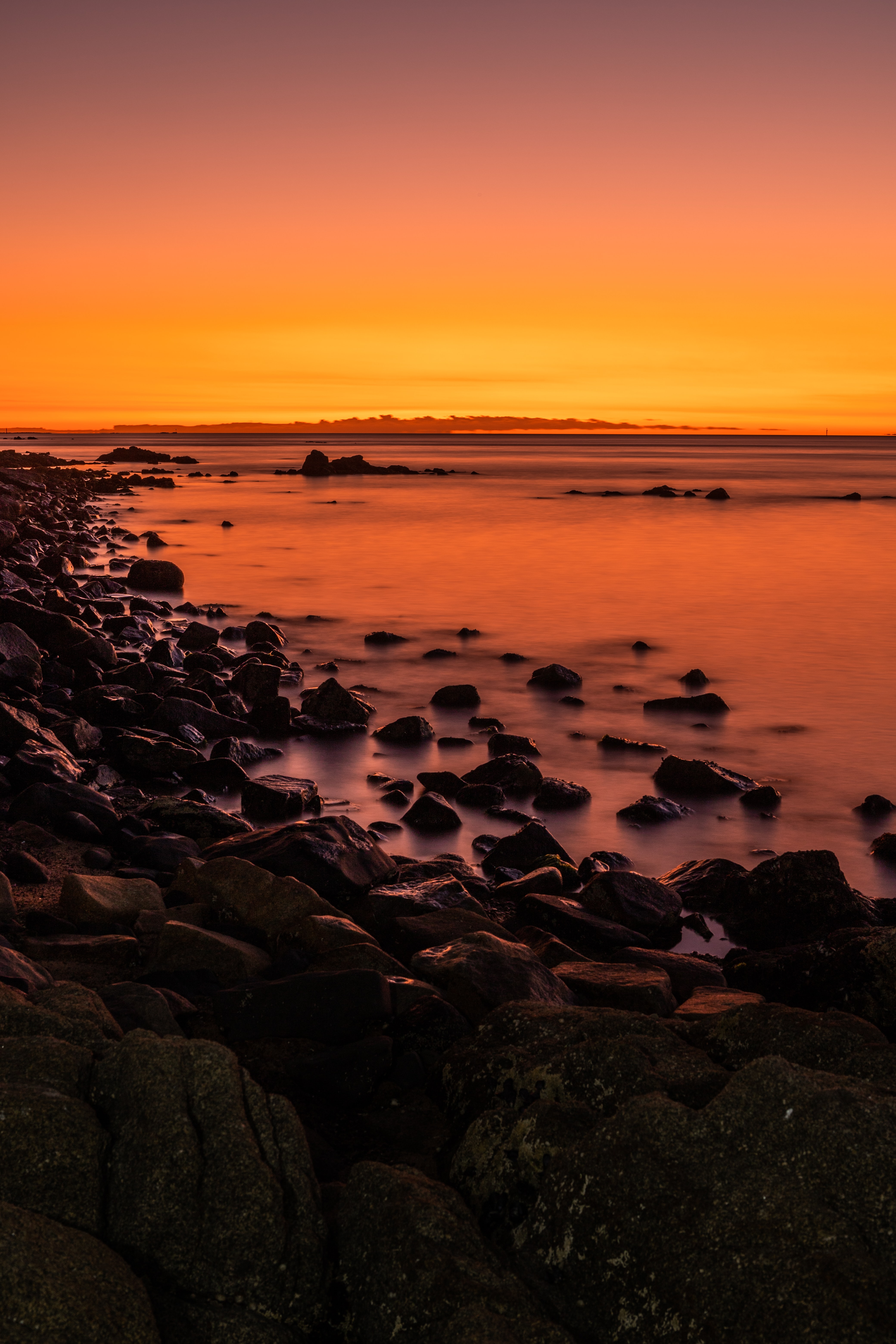 Download mobile wallpaper Horizon, Sunset, Stones, Water, Nature for free.