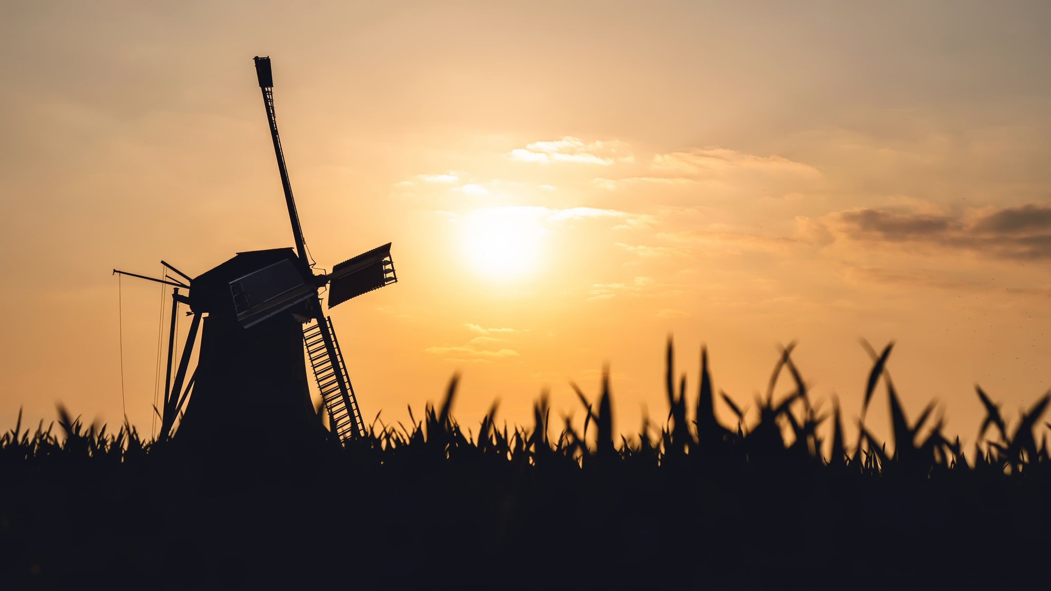 Download mobile wallpaper Sunset, Sky, Sun, Building, Windmill, Man Made for free.
