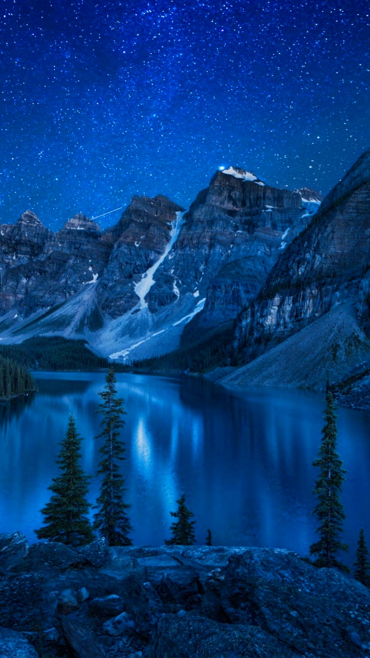 Download mobile wallpaper Winter, Sky, Night, Snow, Lakes, Mountain, Lake, Tree, Earth, Star, Moraine Lake for free.