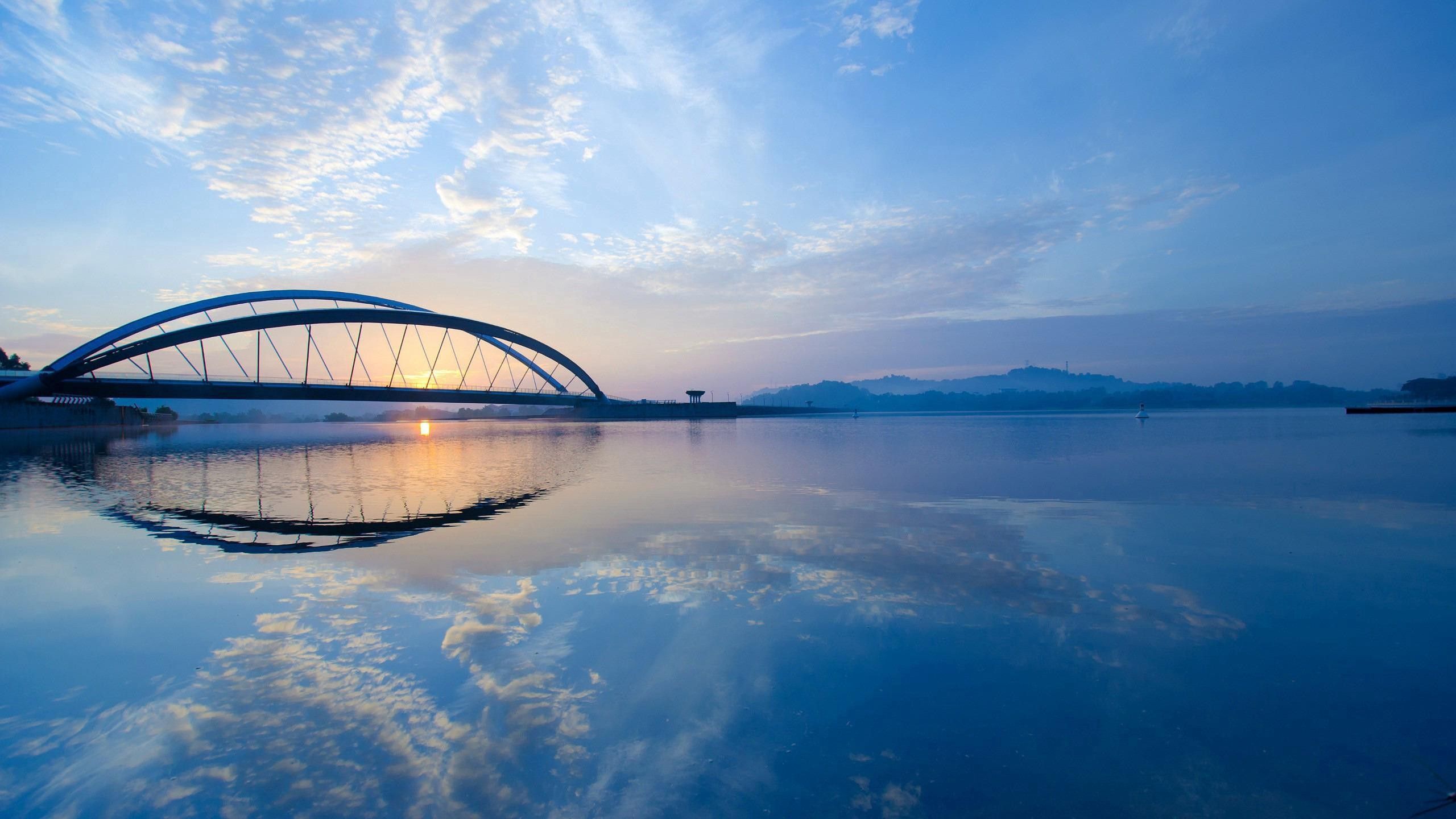 Download mobile wallpaper Bridge, Sky, Rivers, Nature, Sunset for free.