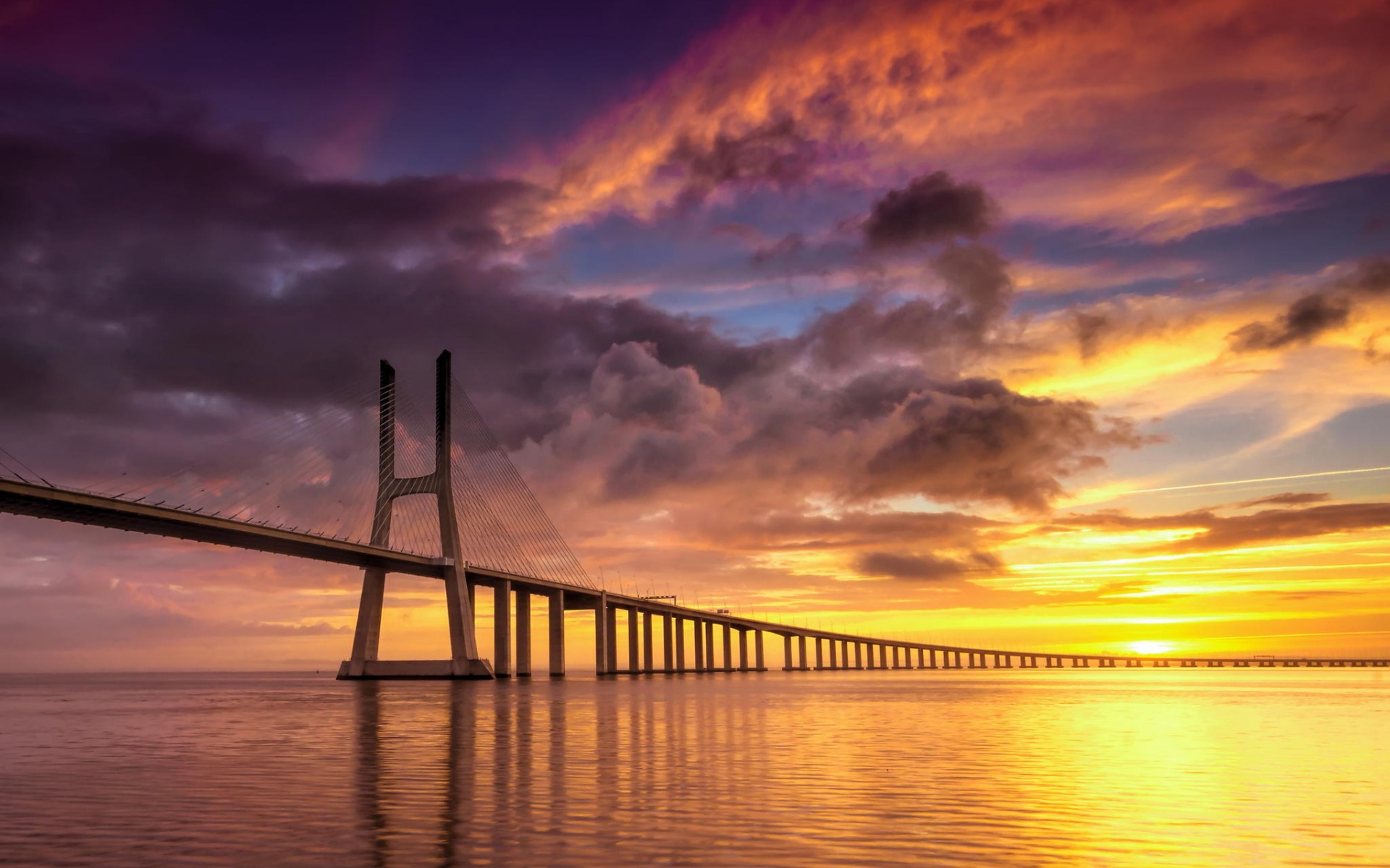 384546 скачать картинку лиссабон, сделано человеком, мост васко да гама, мост, океан, португалия, море, закат, мосты - обои и заставки бесплатно