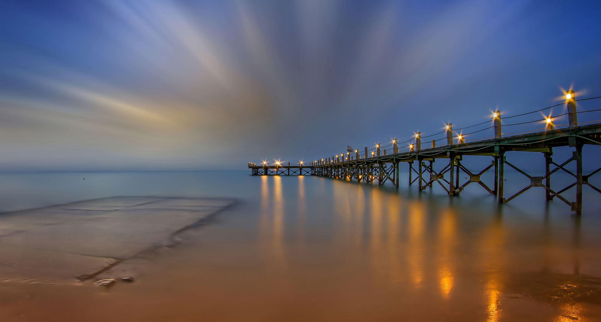 Download mobile wallpaper Sunset, Sea, Night, Light, Pier, Ocean, Man Made for free.