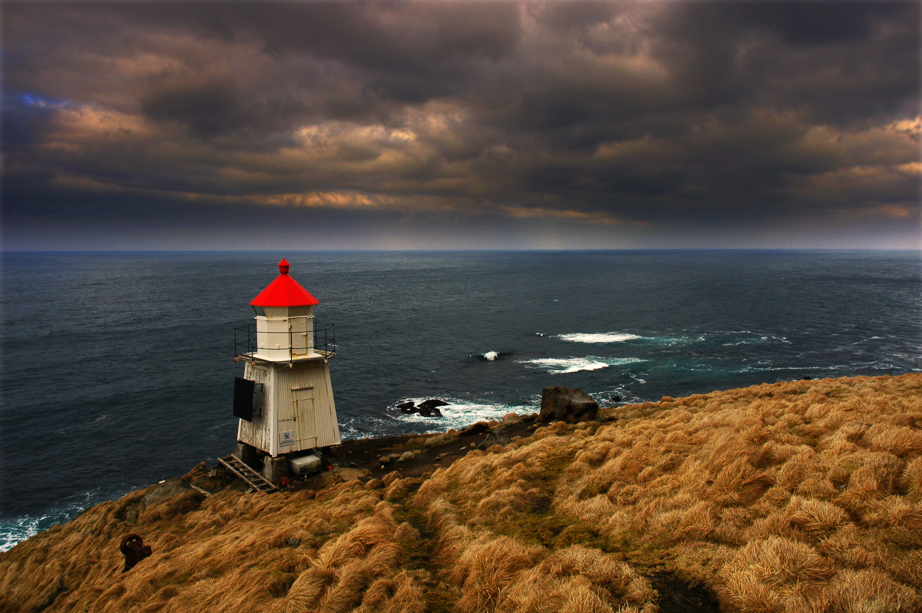 Download mobile wallpaper Ocean, Lighthouse, Cloud, Man Made for free.