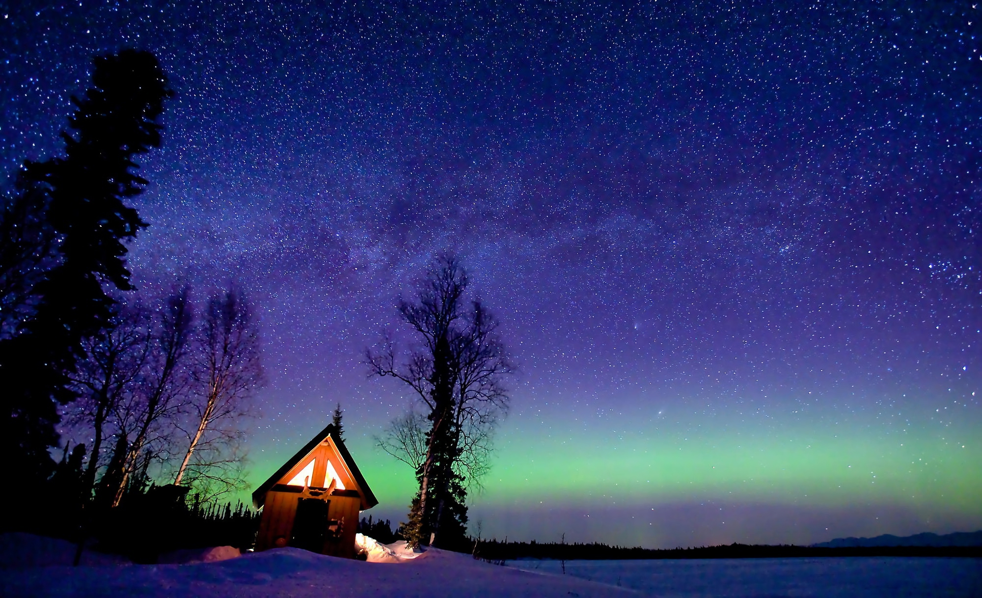 Download mobile wallpaper Winter, Sky, Night, Tree, Starry Sky, Aurora Borealis, Cabin, Man Made for free.