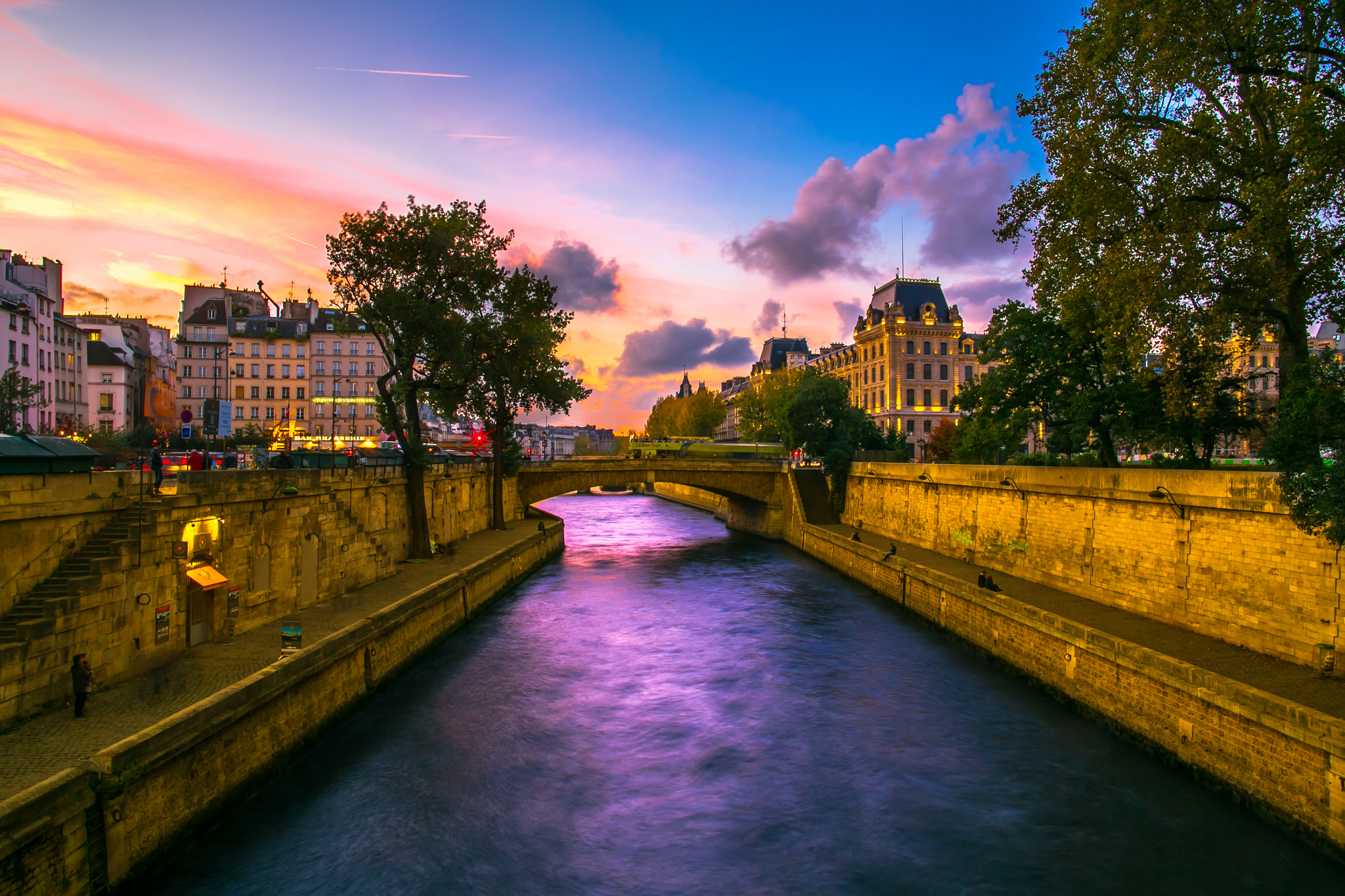 Download mobile wallpaper Cities, Sunset, Paris, City, Bridge, Man Made, Canal for free.