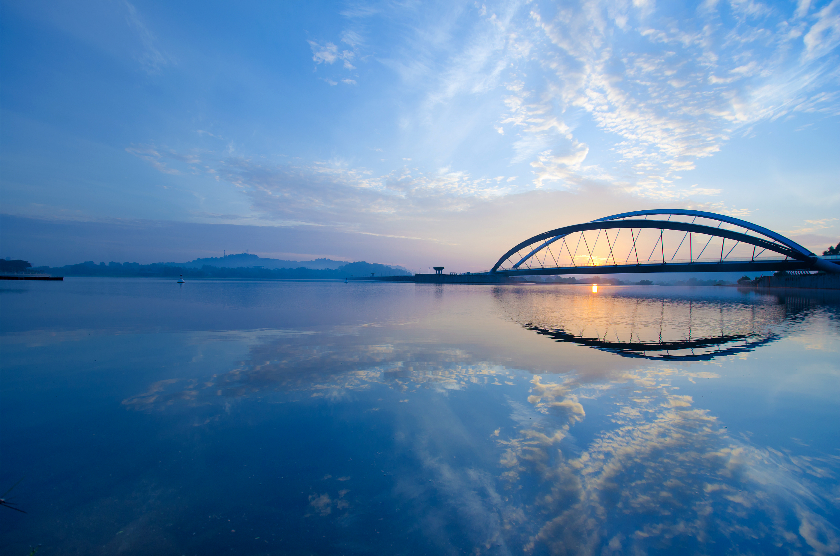 Download mobile wallpaper Sunset, Reflection, Bridge, Man Made for free.