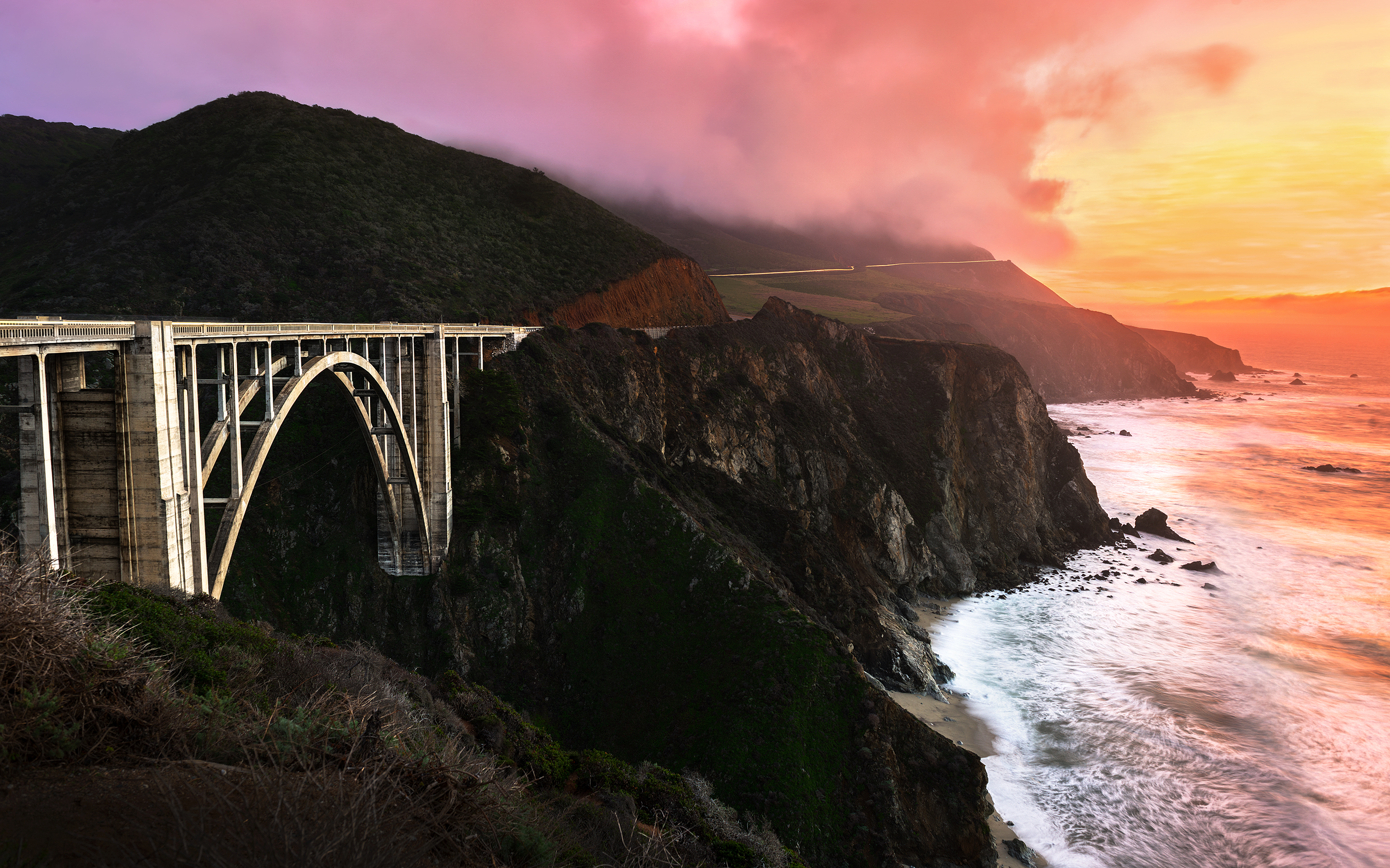 Baixar papel de parede para celular de Pontes, Pôr Do Sol, Mar, Montanha, Estrada, Oceano, Ponte, Nuvem, Linha Costeira, Feito Pelo Homem gratuito.