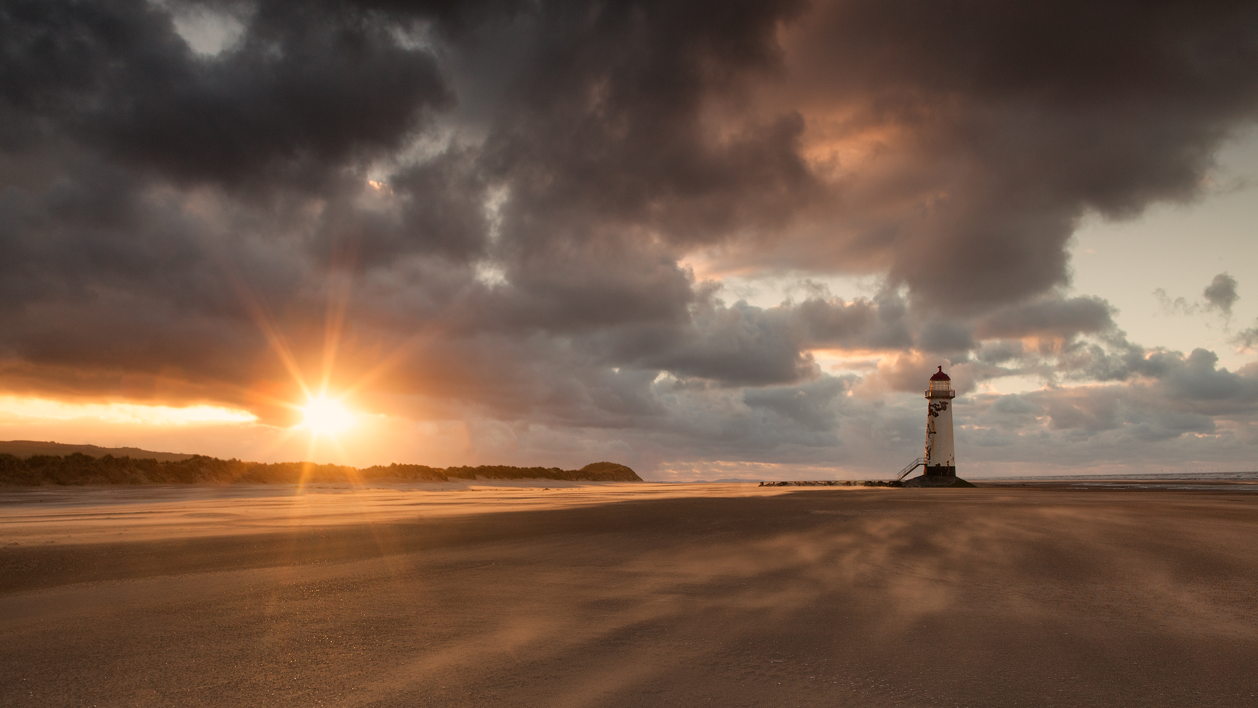 Download mobile wallpaper Sun, Beach, Lighthouse, Sunbeam, Man Made for free.