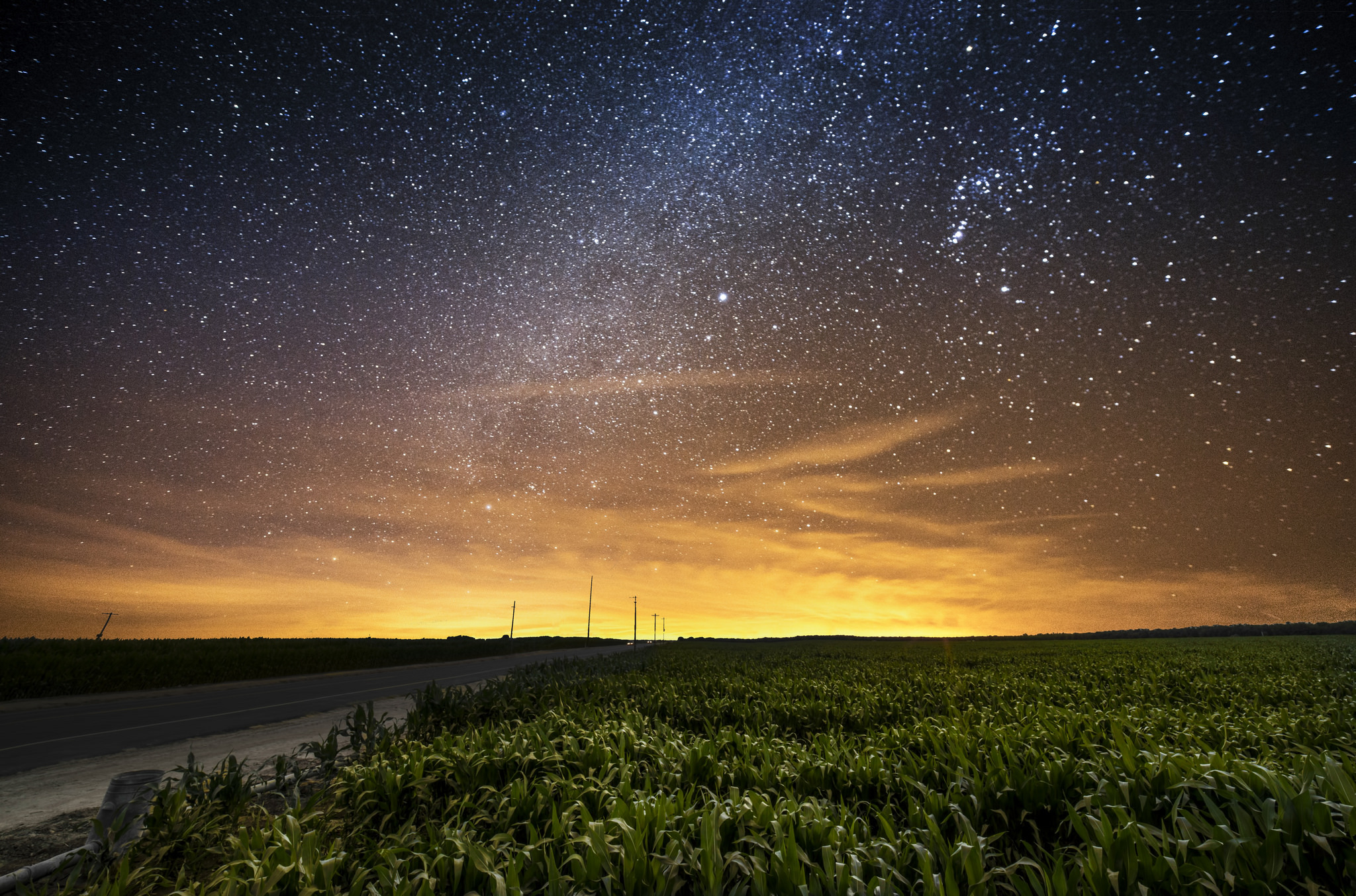 Download mobile wallpaper Landscape, Sky, Stars, Night, Road, Starry Sky, Field, Man Made for free.