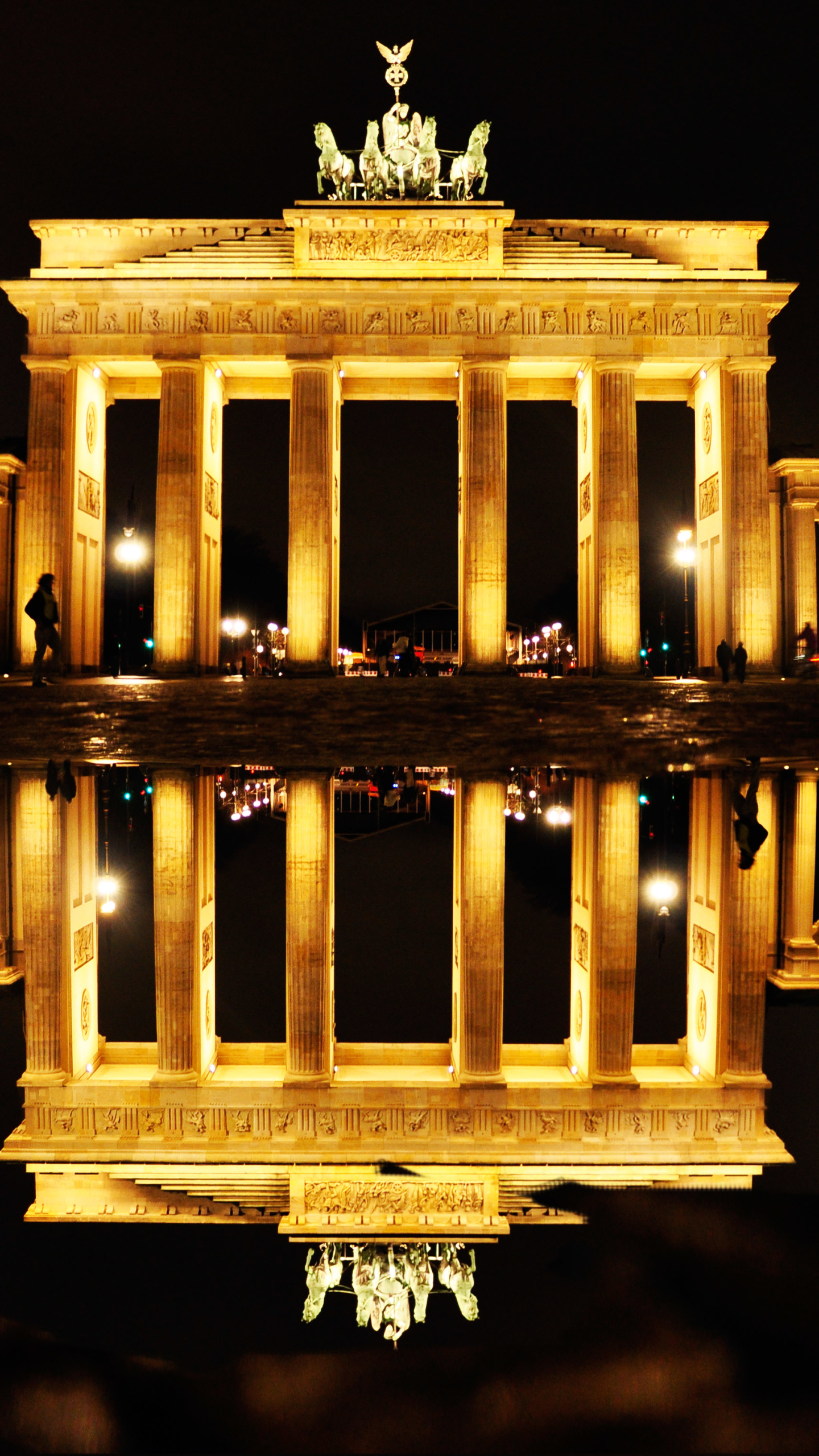 Download mobile wallpaper Night, Berlin, Monuments, Reflection, Light, Monument, Germany, Man Made, Brandenburg Gate for free.