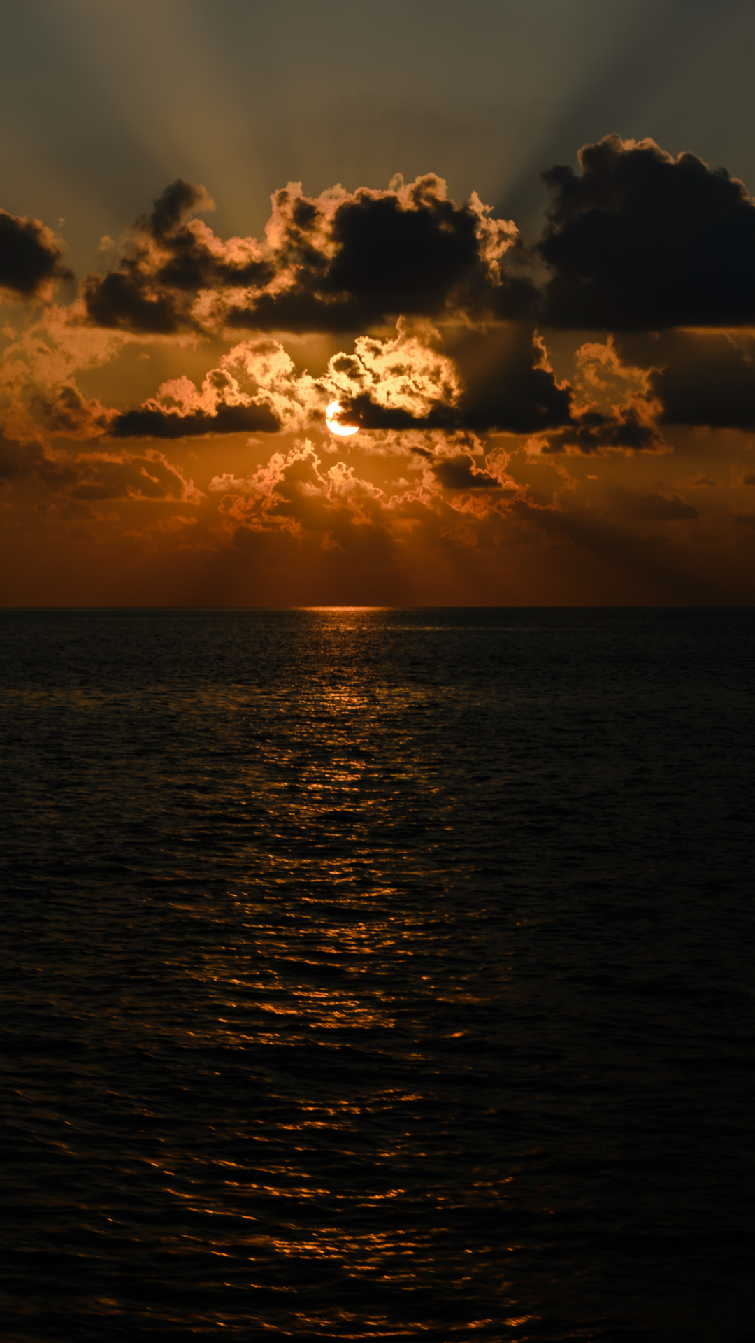 Download mobile wallpaper Sunset, Sun, Horizon, Ocean, Earth, Cloud, Sunbeam, Sunbean for free.