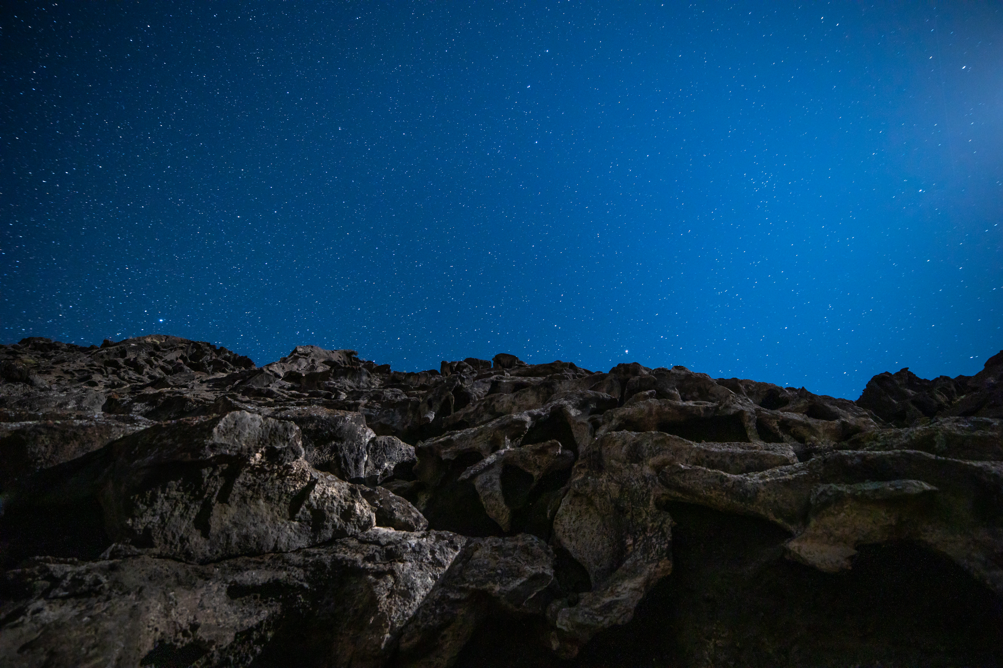 Download mobile wallpaper Stones, Rocks, Stars, Nature, Starry Sky, Night for free.