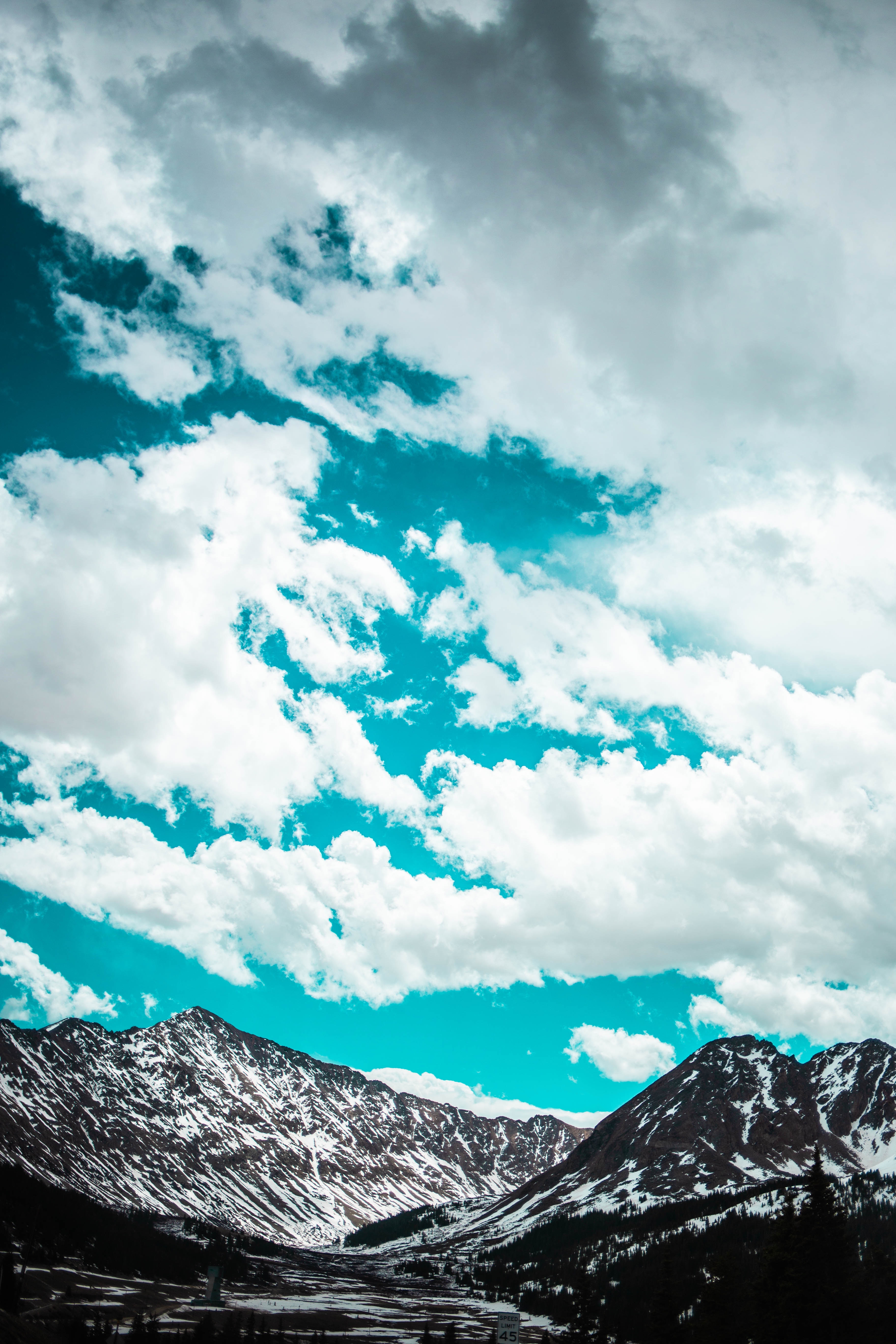 Free download wallpaper Nature, Sky, Clouds, Snowbound, Snow Covered, Mountains, Porous on your PC desktop