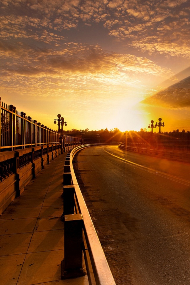 Download mobile wallpaper Sunset, Sky, Road, Lamp Post, Man Made for free.