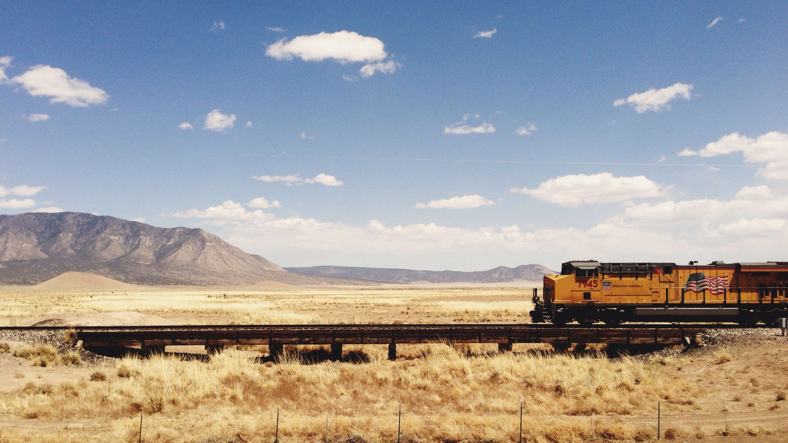 Free download wallpaper Landscape, Sky, Desert, Hill, Cloud, Train, Railroad, Vehicles on your PC desktop