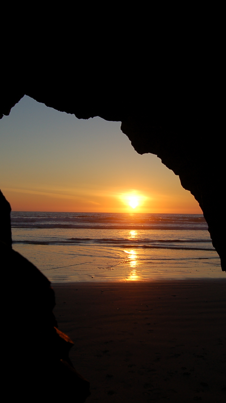 Download mobile wallpaper Sunset, Beach, Ocean, Earth, Cave for free.