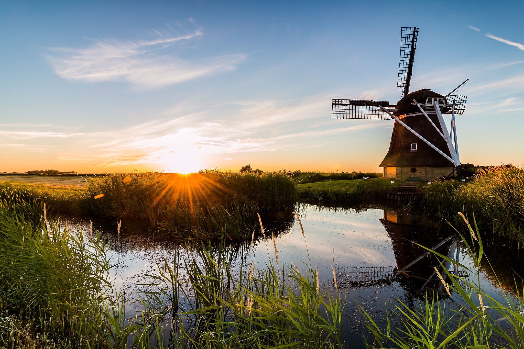 Download mobile wallpaper Sky, Building, Reflection, Sunrise, Windmill, Man Made for free.