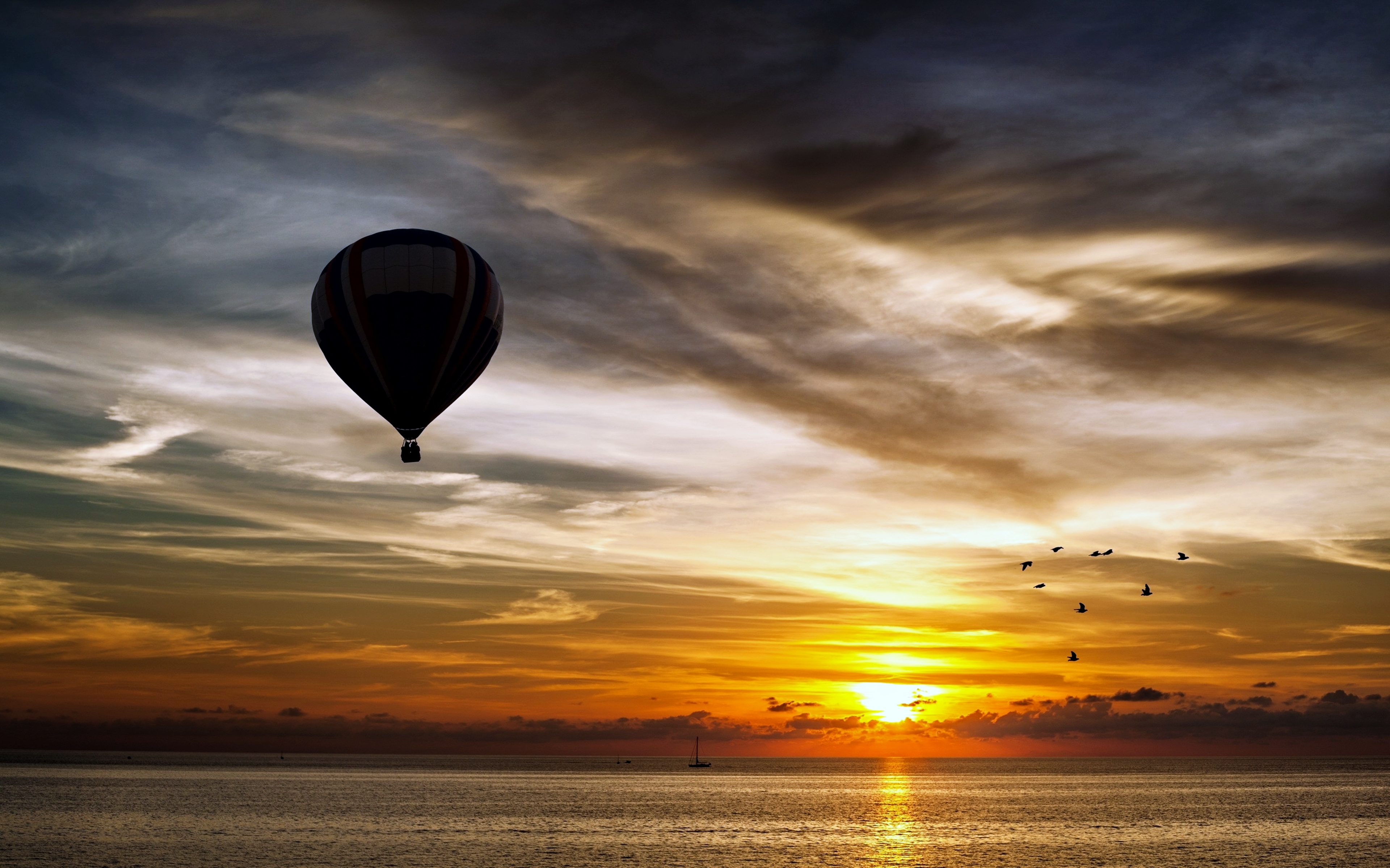 Download mobile wallpaper Landscape, Sunset, Sea, Ocean, Earth, Cloud, Photography, Hot Air Balloon for free.