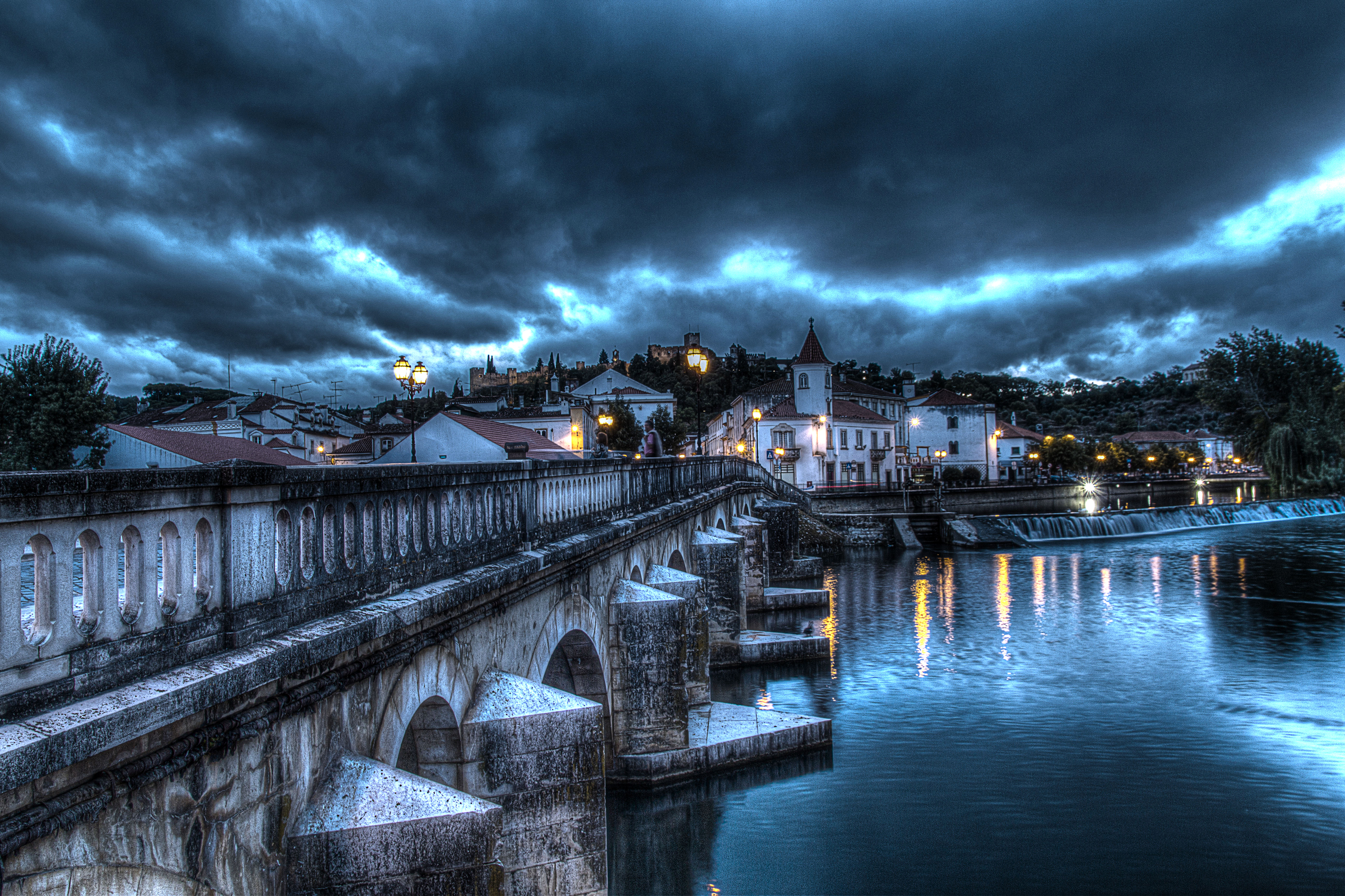 Download mobile wallpaper Night, House, Bridge, Hdr, Cloud, Portugal, Town, Man Made, Santarém, Towns for free.