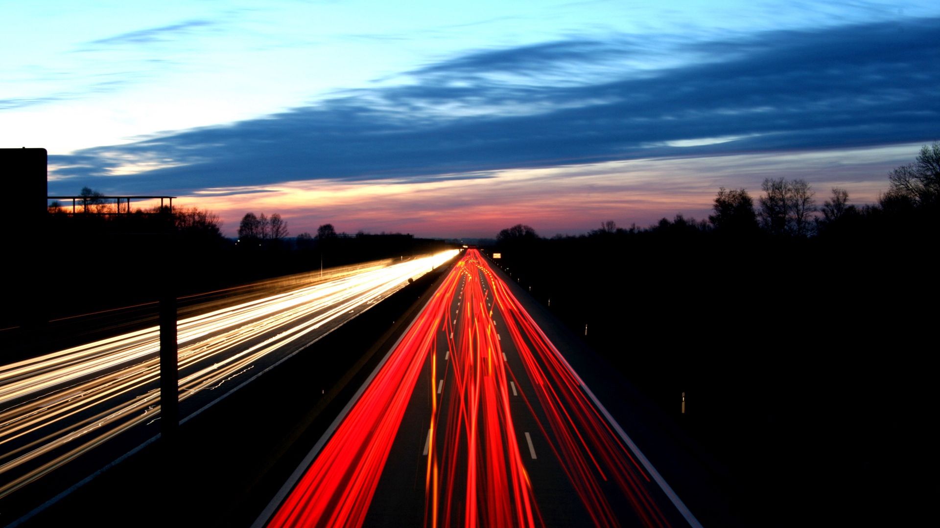 Download mobile wallpaper Traffic, Cities, Movement, Road, Sky, Shine, Light, Night for free.