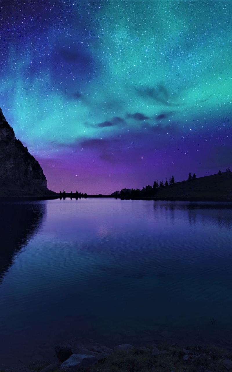 Download mobile wallpaper Stars, Night, Mountain, Lake, Light, Silhouette, Starry Sky, Earth, Aurora Borealis for free.