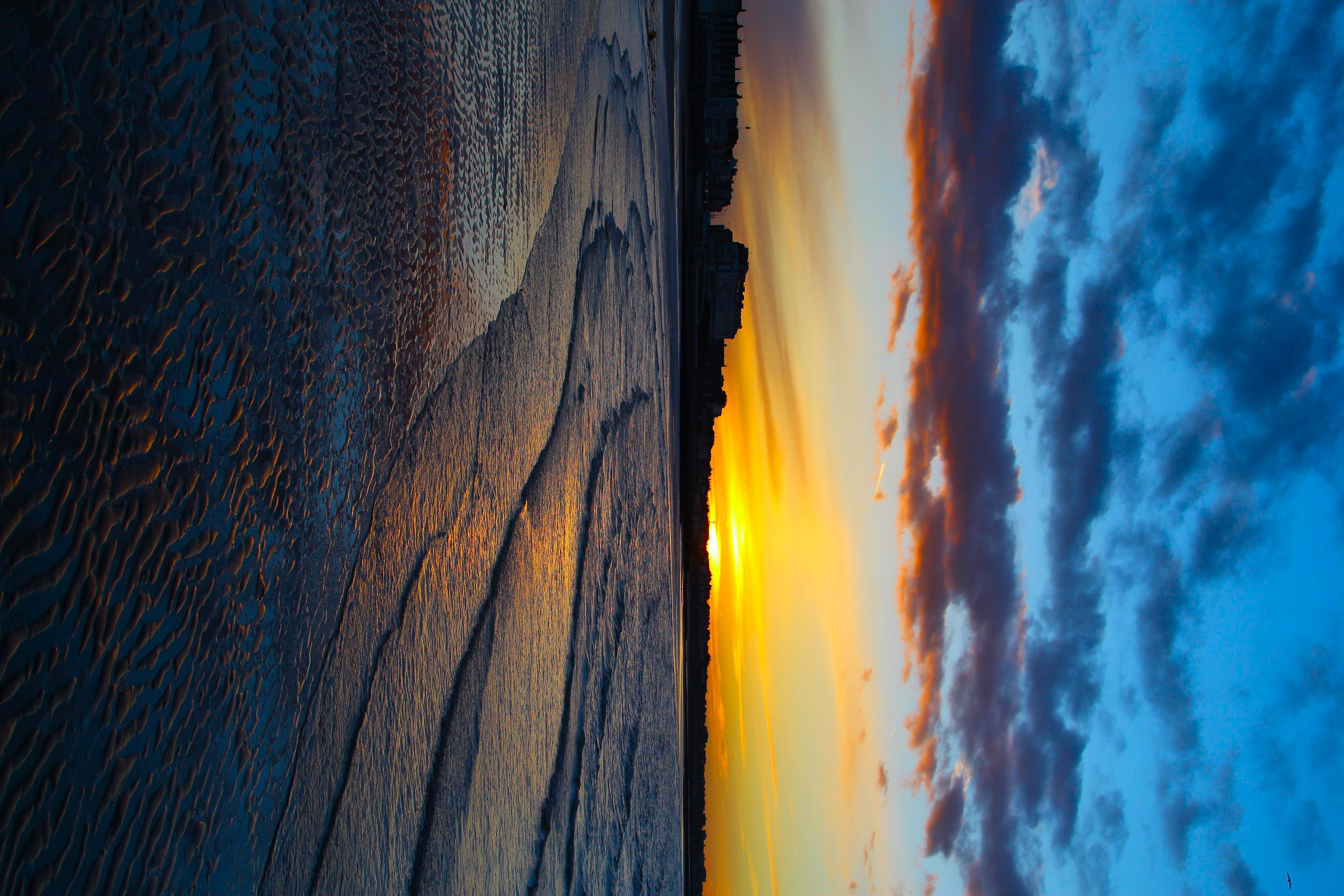 Download mobile wallpaper Ripples, Ripple, Cities, City, Coast, Sunset, Beach for free.