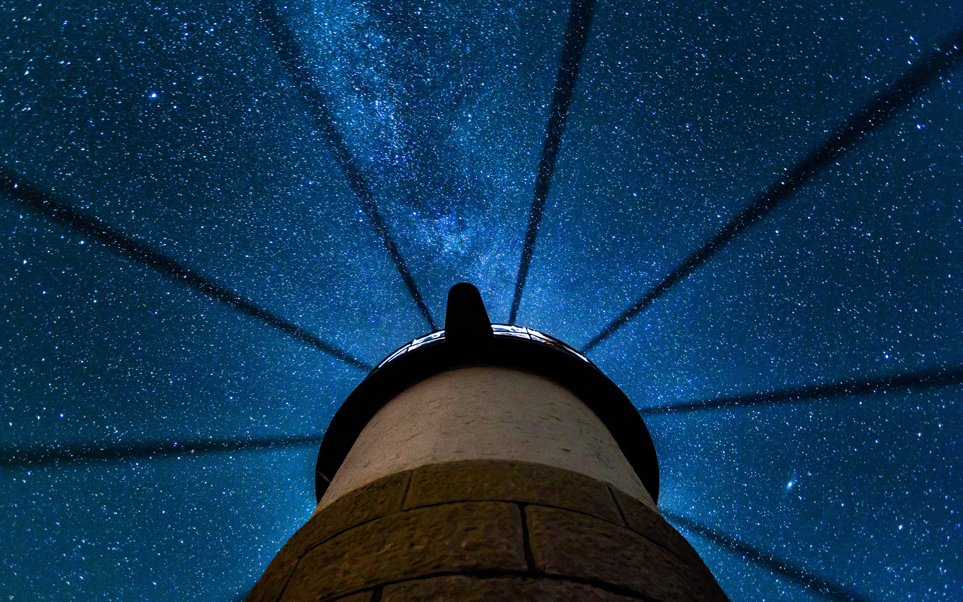 Download mobile wallpaper Sky, Stars, Night, Light, Starry Sky, Lighthouse, Man Made for free.