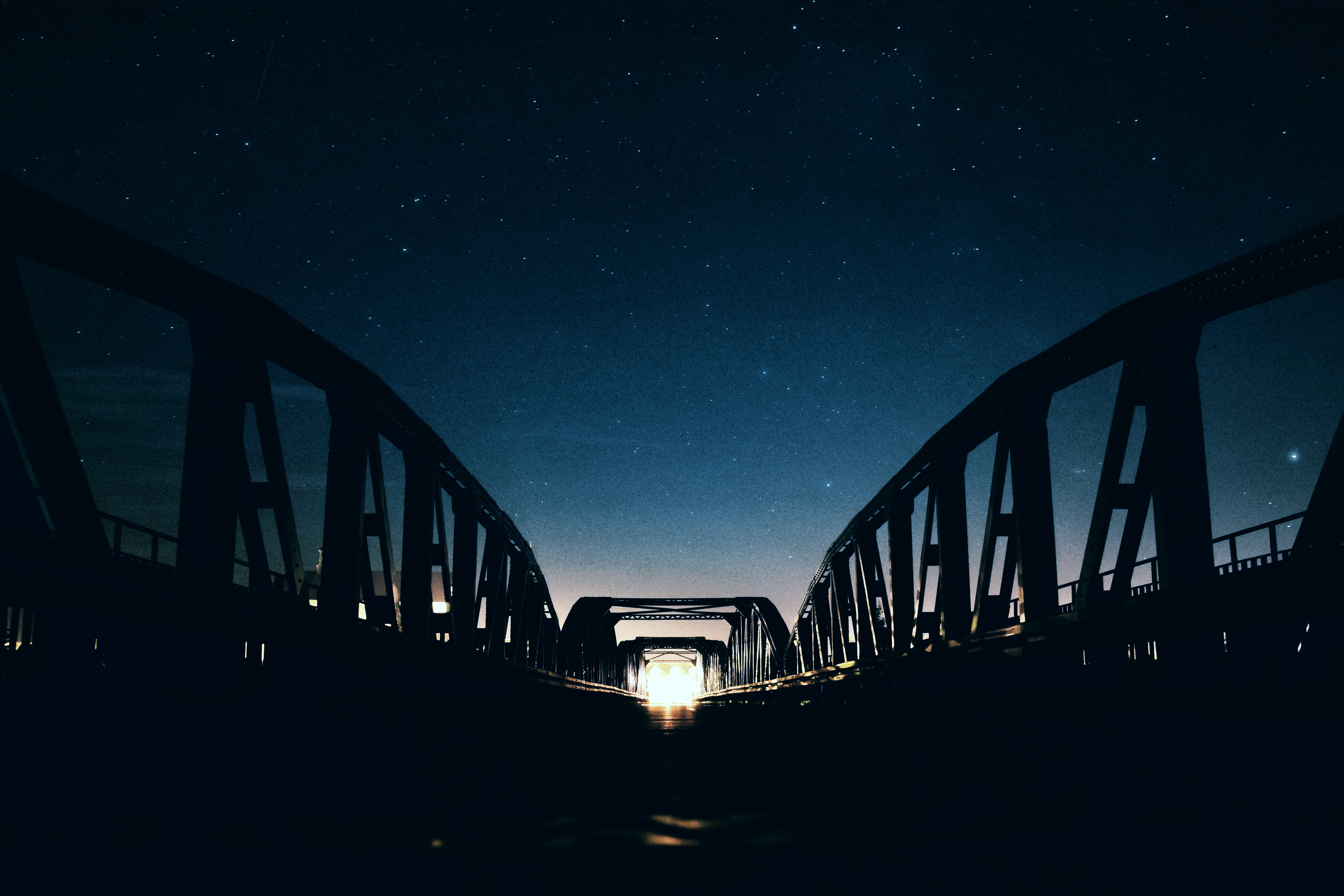 Download mobile wallpaper Bridge, Shine, Light, Night, Starry Sky, Dark for free.