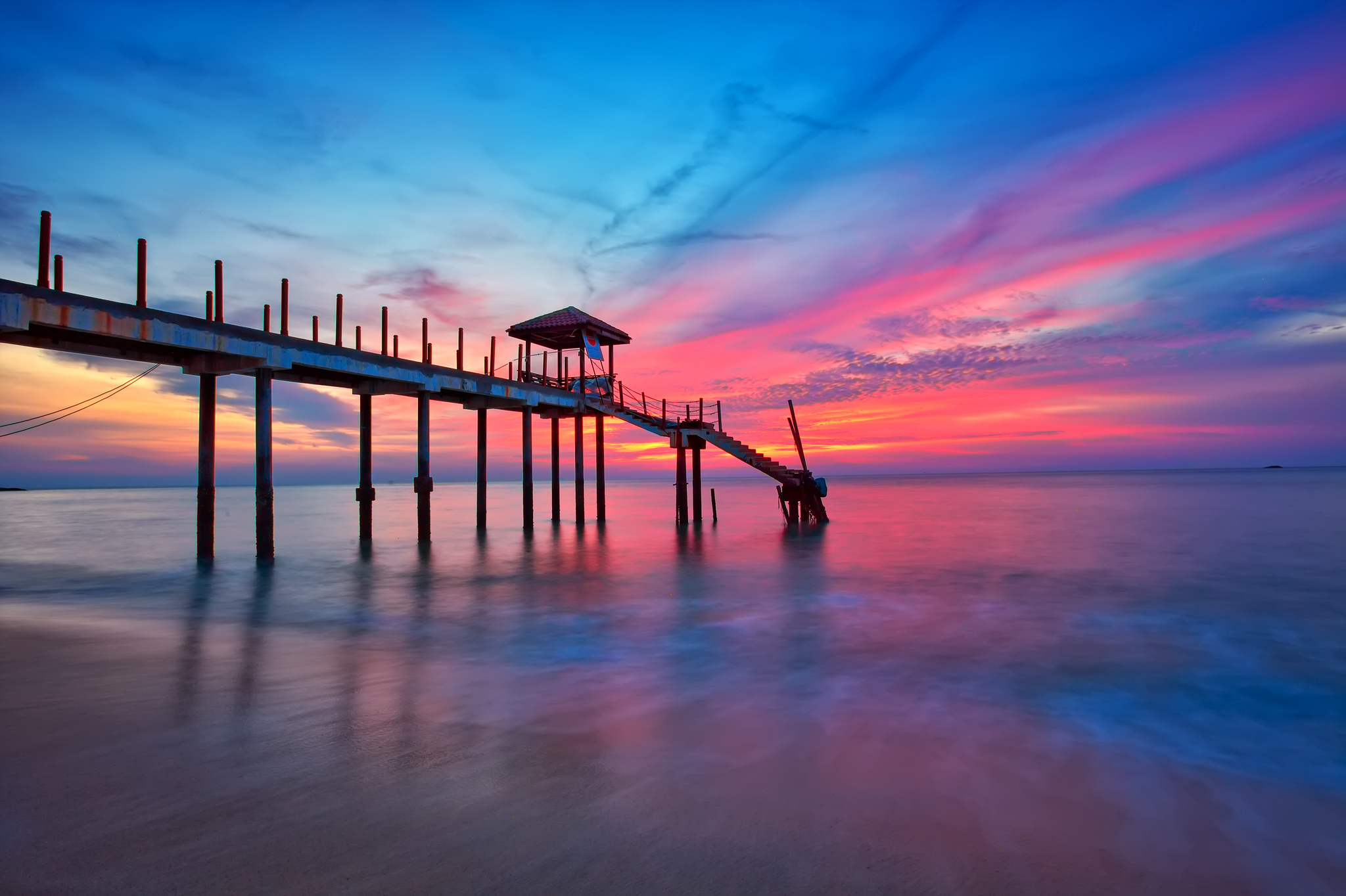 Download mobile wallpaper Sunset, Sky, Pink, Pier, Ocean, Purple, Man Made for free.
